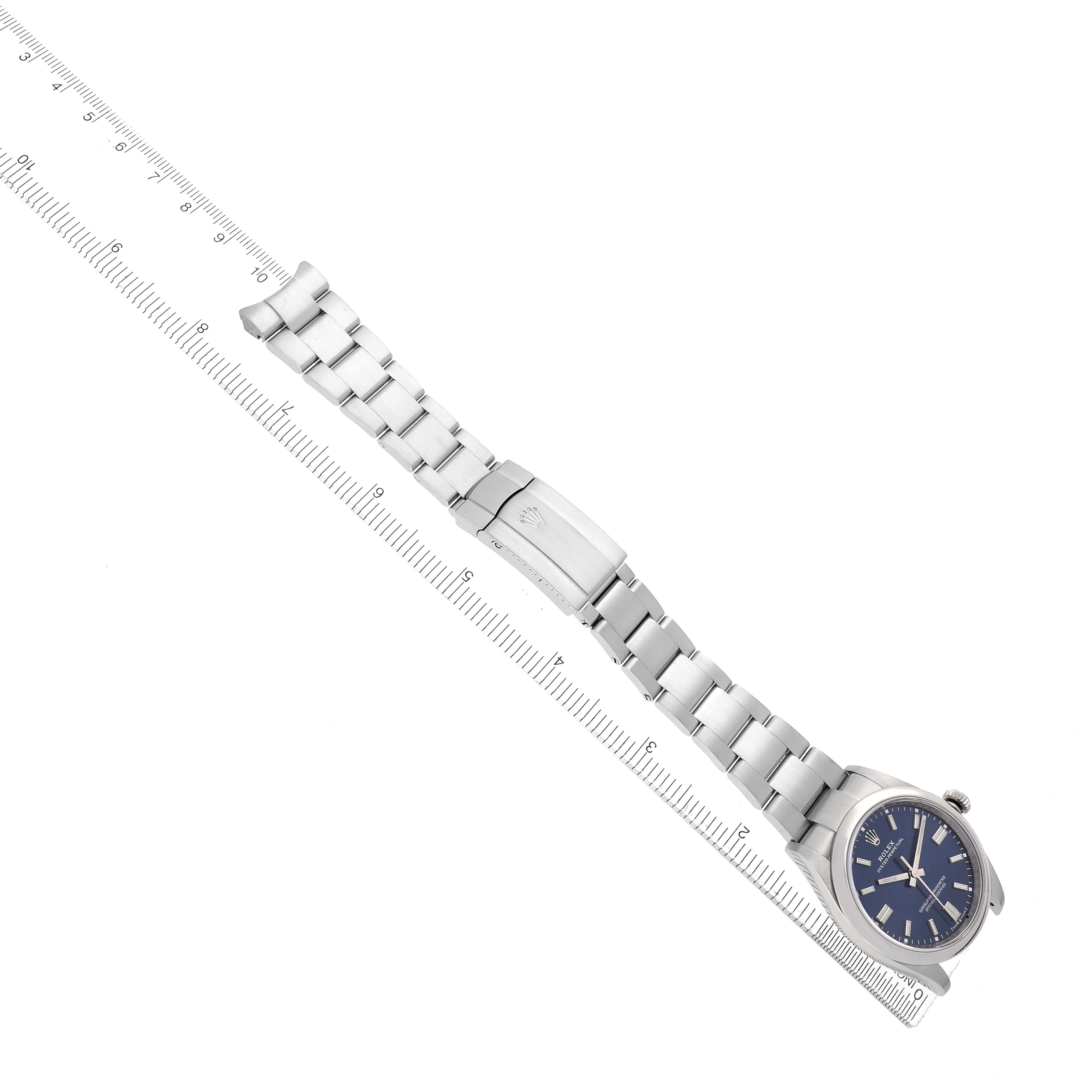 The Rolex Oyster Perpetual 126000 Men
s Stainless Steel Blue Dial watch is shown diagonally, displaying the face, bracelet, and clasp.