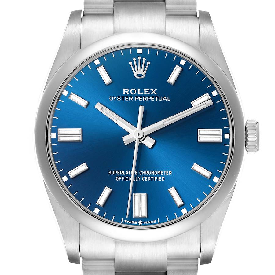 The Rolex Oyster Perpetual model 126000 is shown from the front, highlighting the blue dial, hour markers, hands, crown, and part of the bracelet.