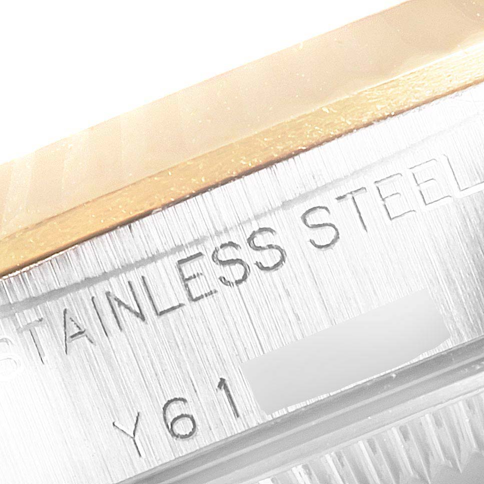 This close-up image shows the stainless steel and part of the bezel of a Rolex Datejust 76193 Women's Steel and Gold (two tone) Champagne Dial 76193 Women's Steel and Gold (two tone) Champagne Dial watch.