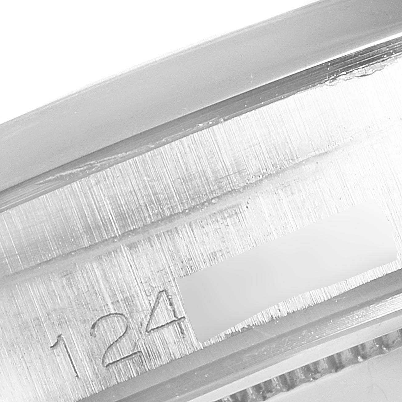 This close-up image shows the serial number engraved on the case of a Rolex Vintage Collection 6694 Men's Stainless Steel Black Dial 6694 Men's Stainless Steel Black Dial watch.