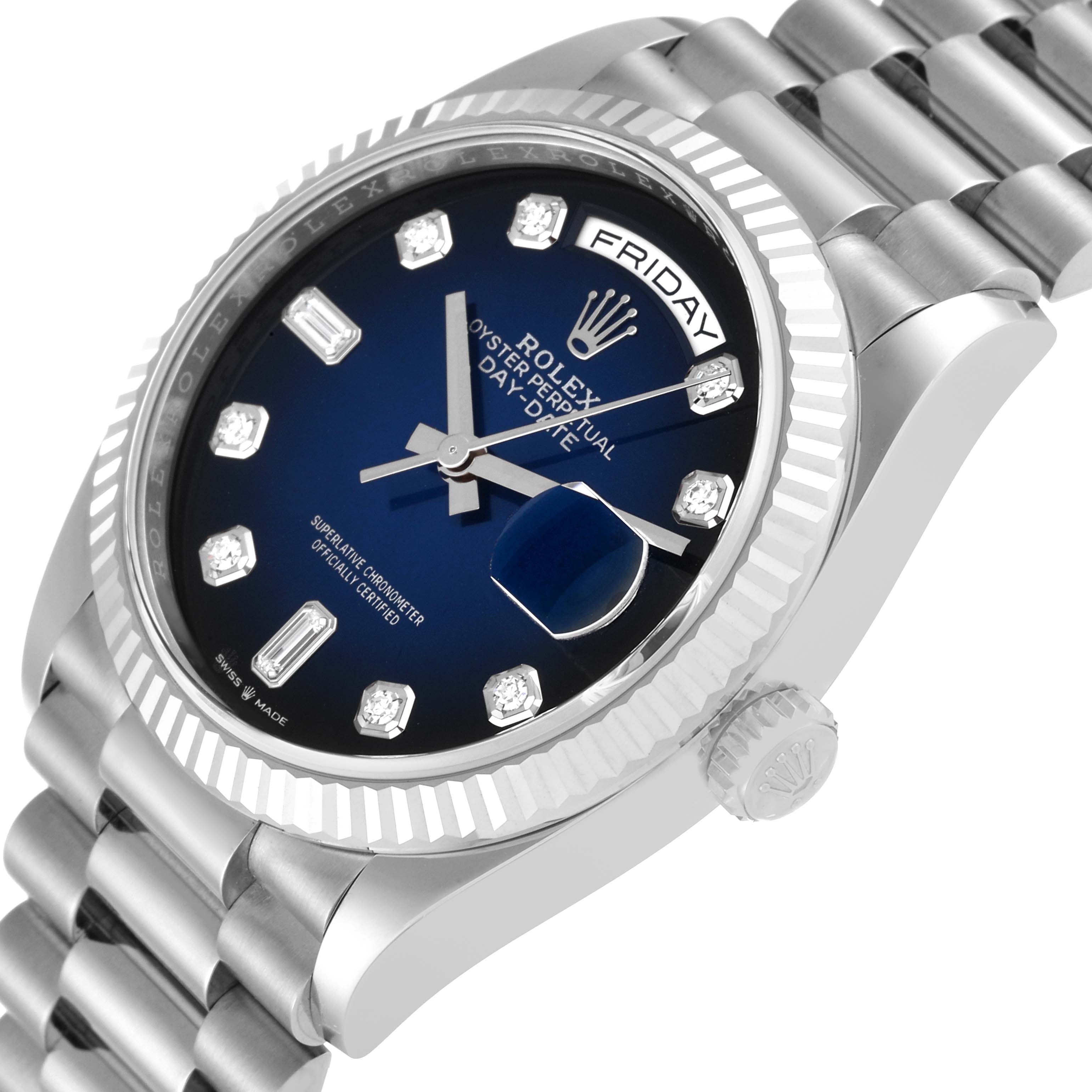 The image shows a side angle of the Rolex President 128239 Men
s White Gold Blue Dial 128239 Men
s White Gold Blue Dial model, highlighting the blue dial, day display, crown, and bracelet.