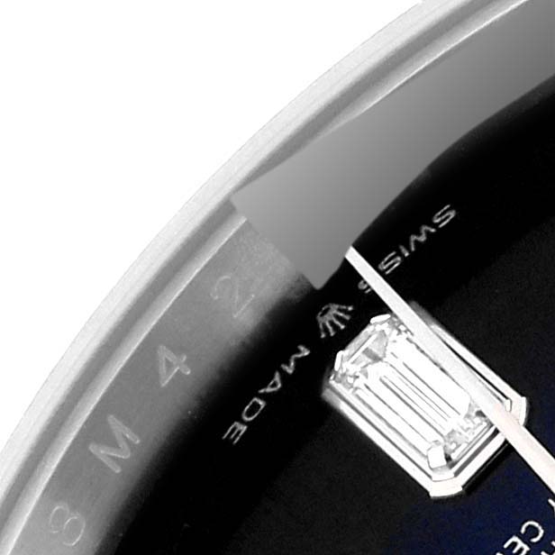 This close-up image shows partial dial details including diamonds and part of the bezel of the Rolex President 128239 Men
s White Gold Blue Dial 128239 Men
s White Gold Blue Dial model watch.