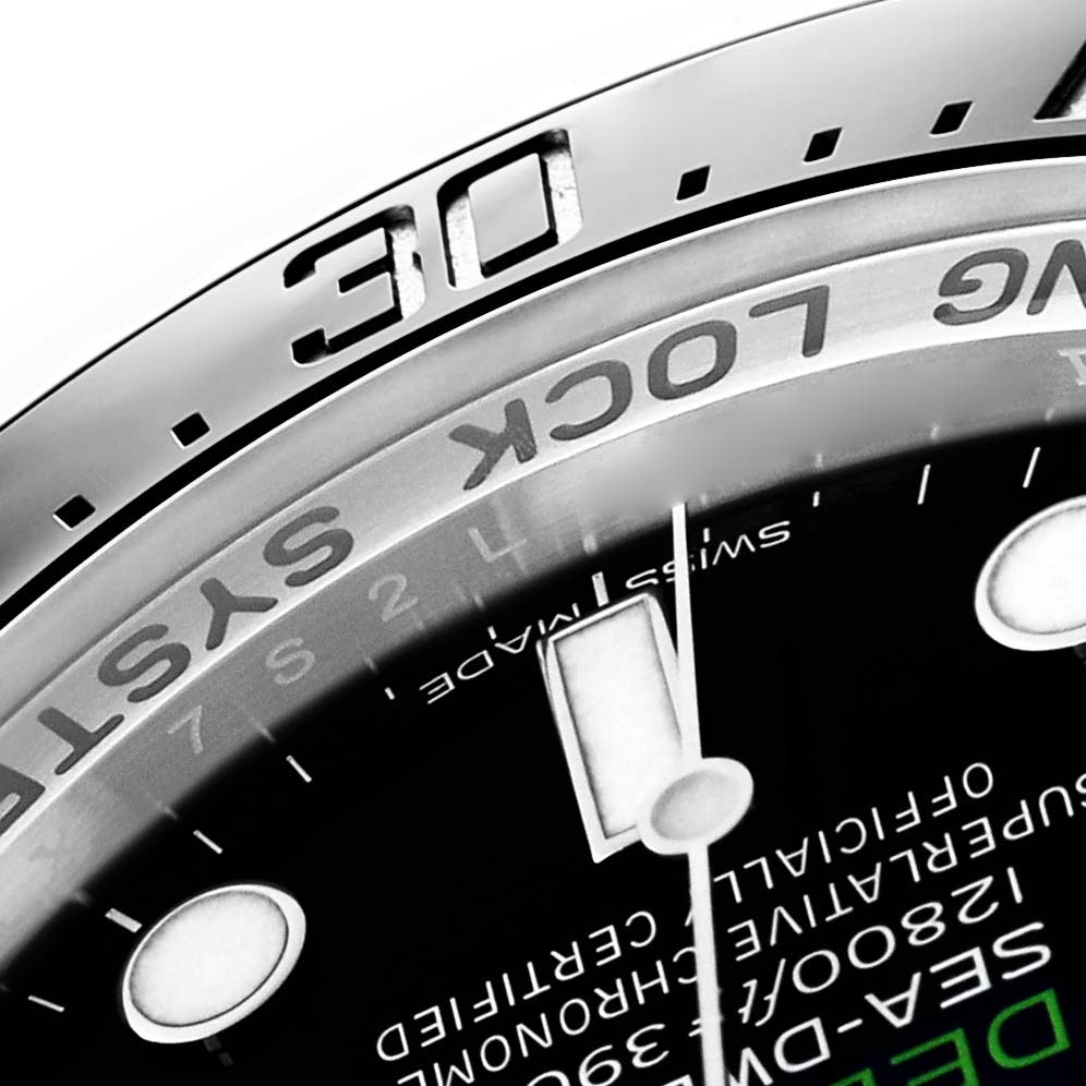 The image shows a close-up of the bezel and part of the dial of a Rolex Sea-Dweller 116660 Men
s Stainless Steel Blue Dial watch, focusing on the "30" mark.