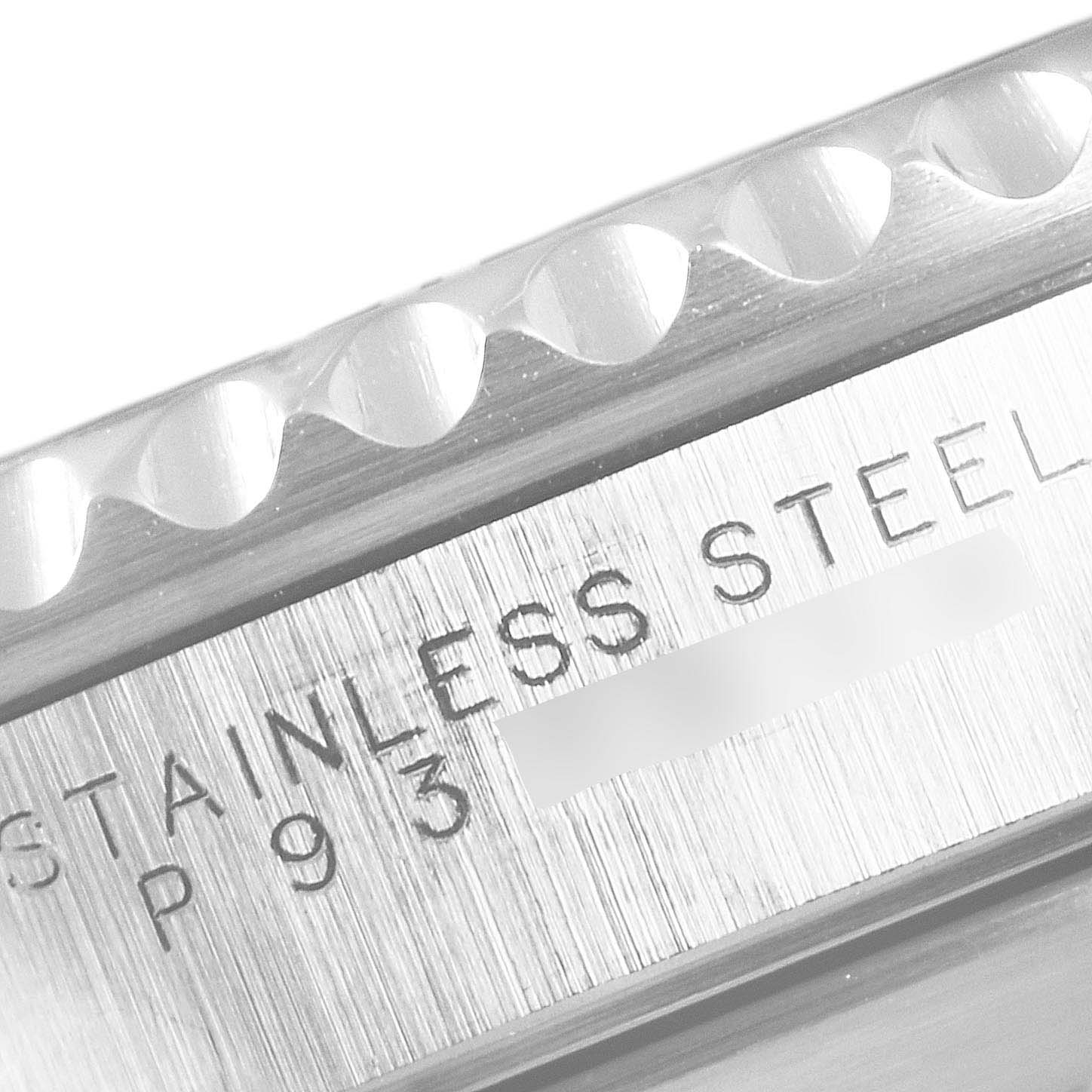 The image shows a close-up of the side/bezel and engraved stainless steel text of a Rolex Submariner 14060 Men
s Stainless Steel Black Dial 14060 Men
s Stainless Steel Black Dial watch.