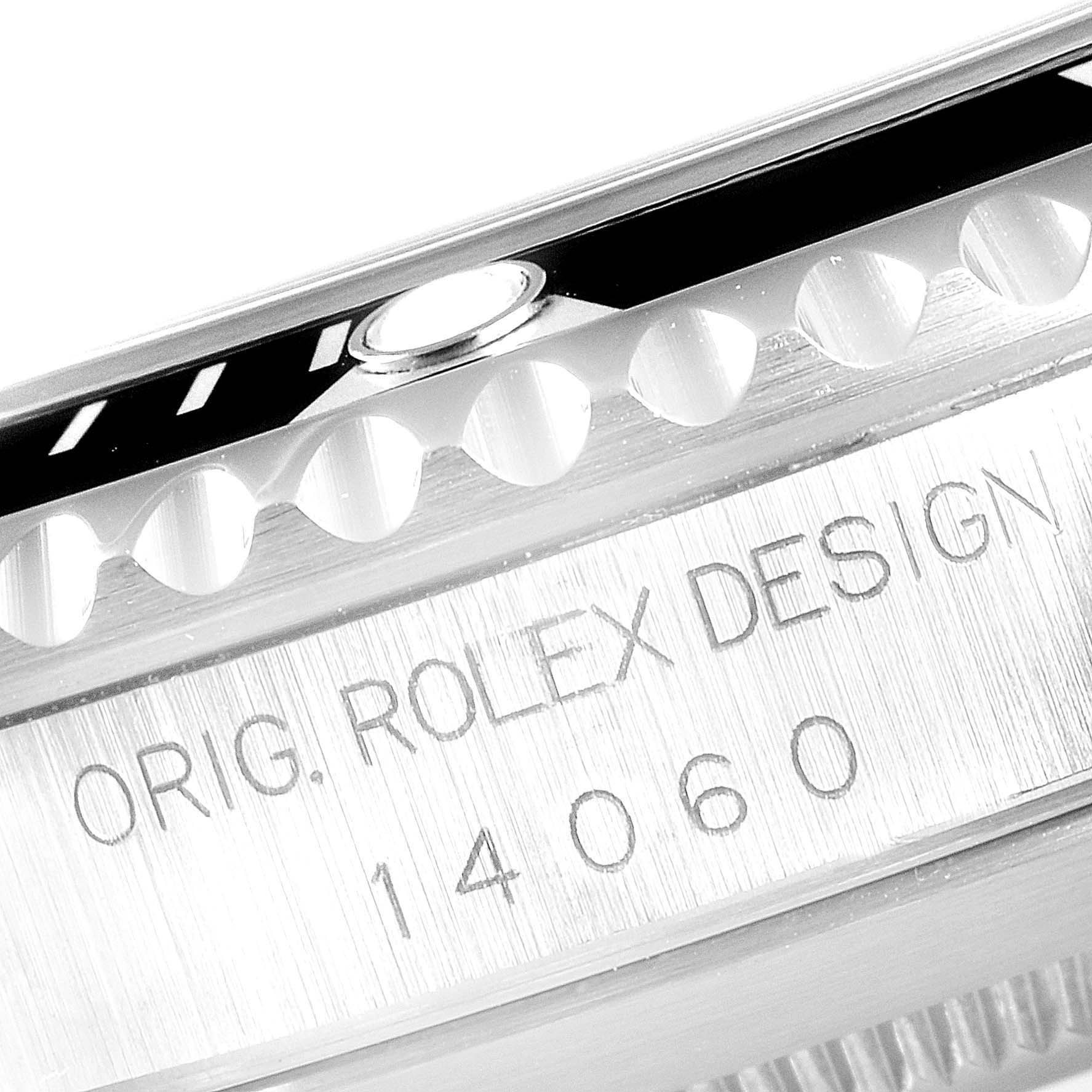 The image shows a close-up of the side engraving and bezel of a Rolex Submariner 14060 Men
s Stainless Steel Black Dial 14060 Men
s Stainless Steel Black Dial watch, with the model number 14060.