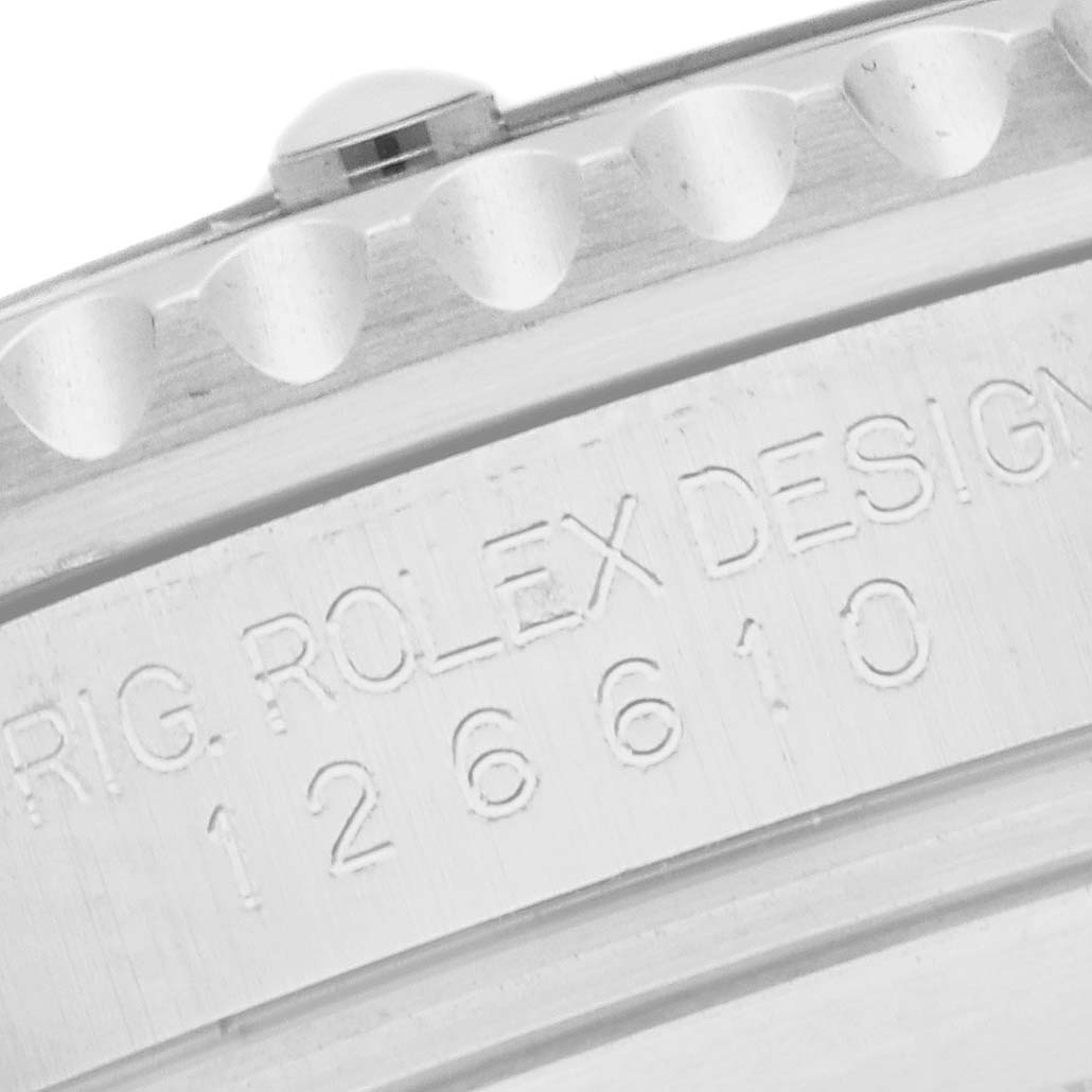 The image shows a close-up of the Rolex Submariner 126610 Men
s Stainless Steel Black Dial
s side, highlighting its engraved model number.