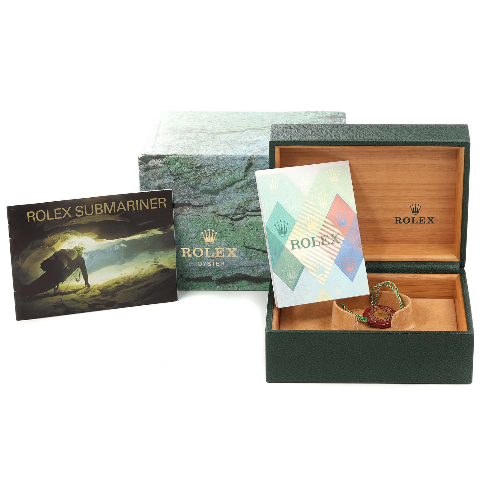 The image shows the packaging, manual, and tags of a Rolex Submariner 16613 Men
s Steel and Gold (two tone) Blue Dial 16613 Men
s Steel and Gold (two tone) Blue Dial watch, including the box and booklets.