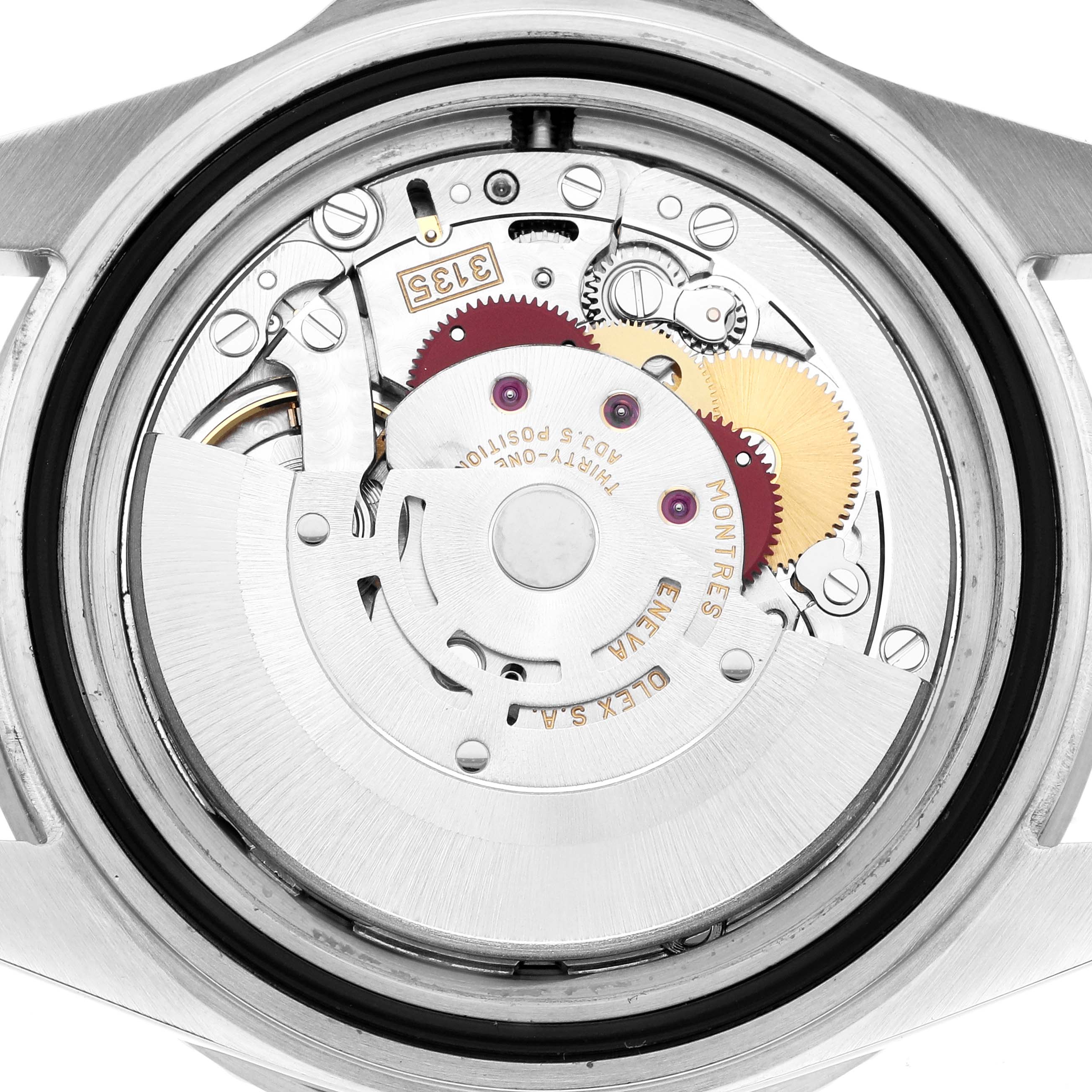 The image shows the movement of a Rolex Submariner 16610 Men
s Stainless Steel Black Dial watch from a back view, highlighting its internal mechanical components.