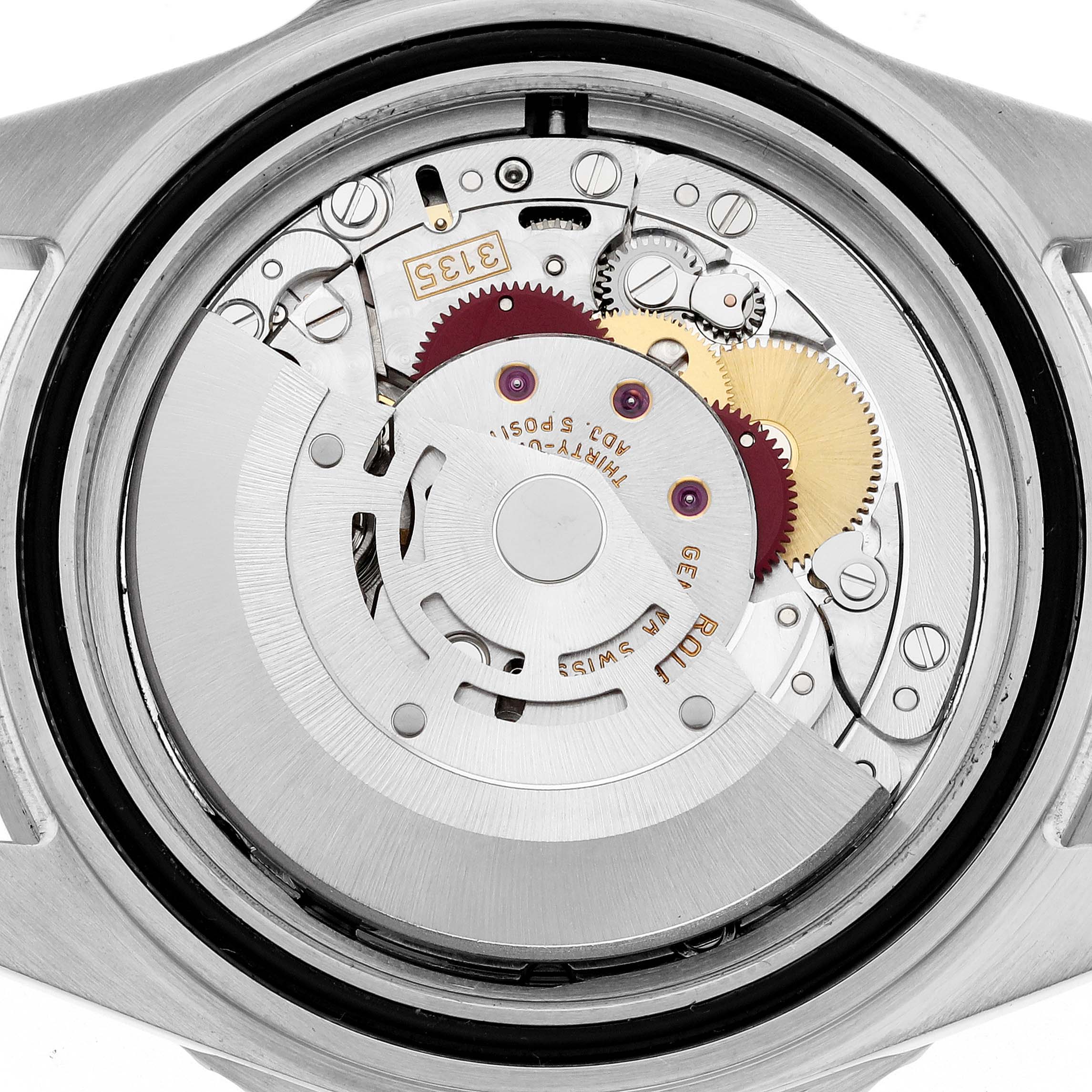 The image shows a close-up of the movement from the back of a Rolex Submariner 16610 Men
s Stainless Steel Black Dial 16610 Men
s Stainless Steel Black Dial watch, highlighting its internal gears and mechanisms.