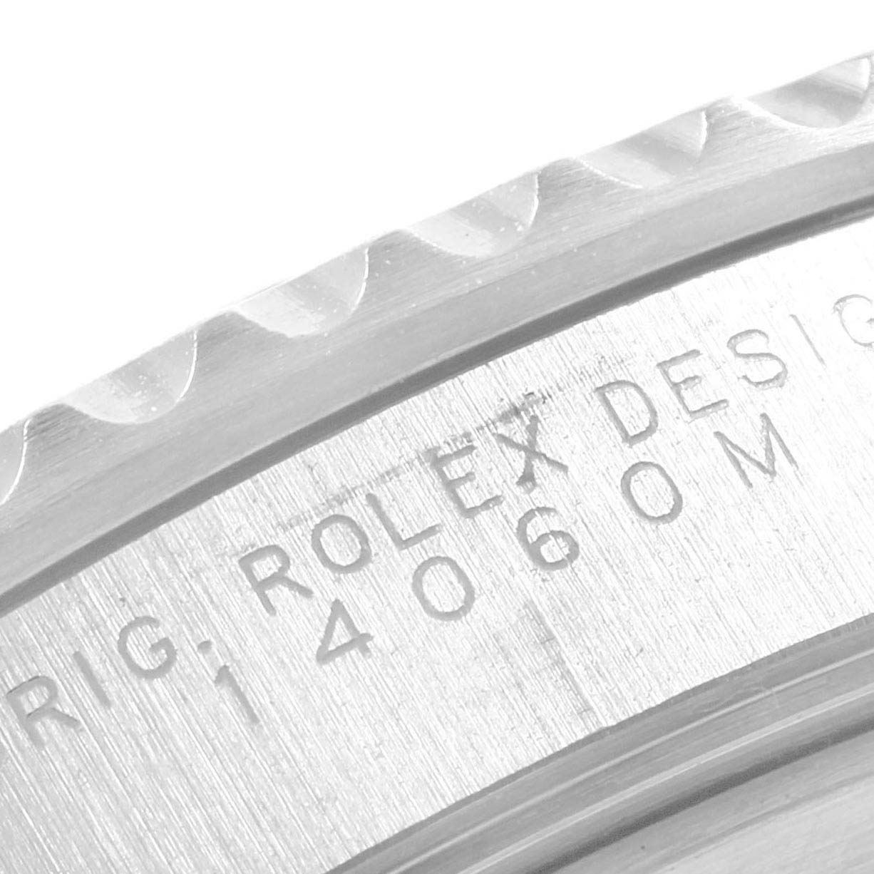 This image shows an angled close-up of the bezel and case side engraving of a Rolex Submariner 14060 Men's Stainless Steel Black Dial 14060 Men's Stainless Steel Black Dial watch.