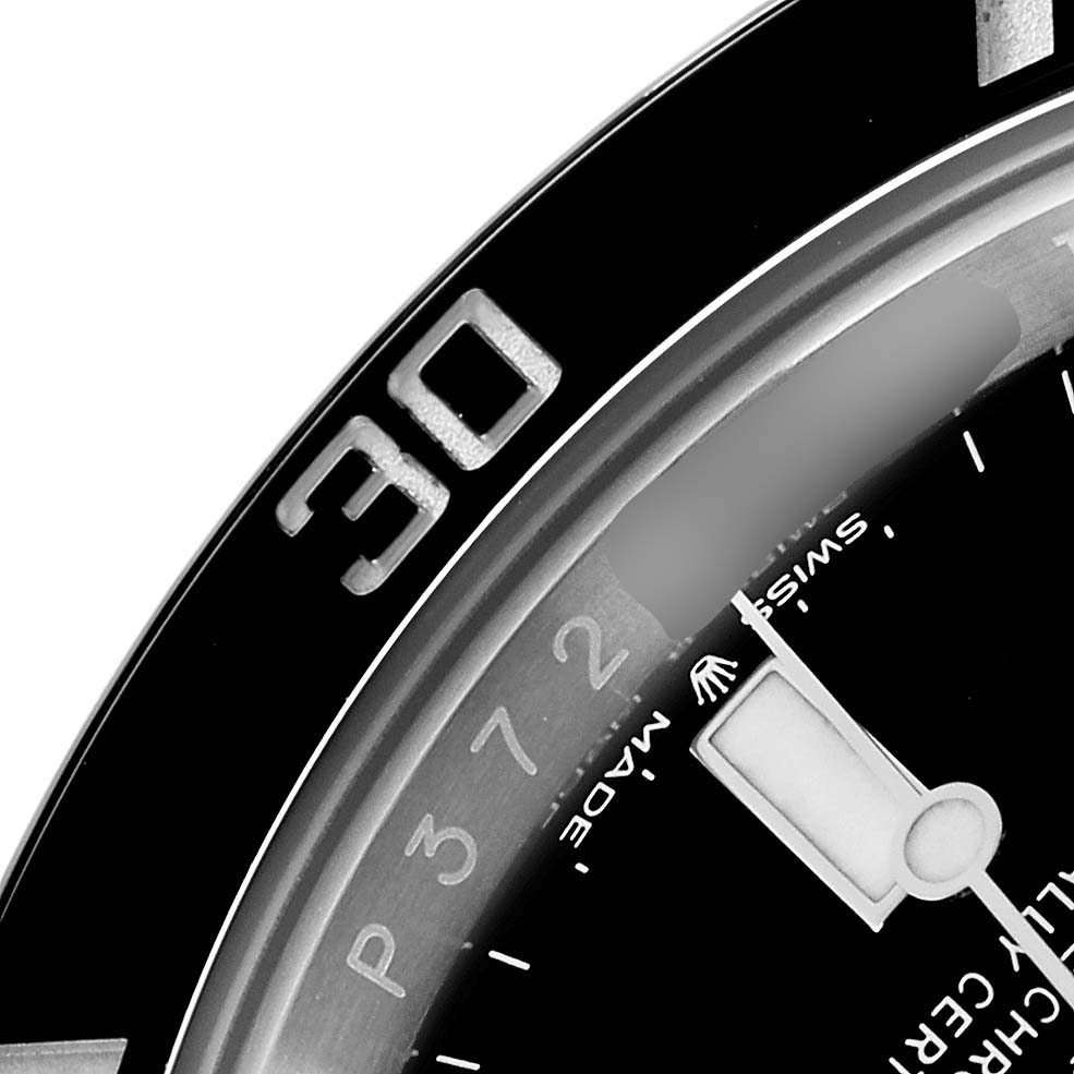 The image shows a close-up of the bezel and dial of a Rolex Submariner 124060 Men
s Stainless Steel Black Dial, including the "30" marker and part of the hands.