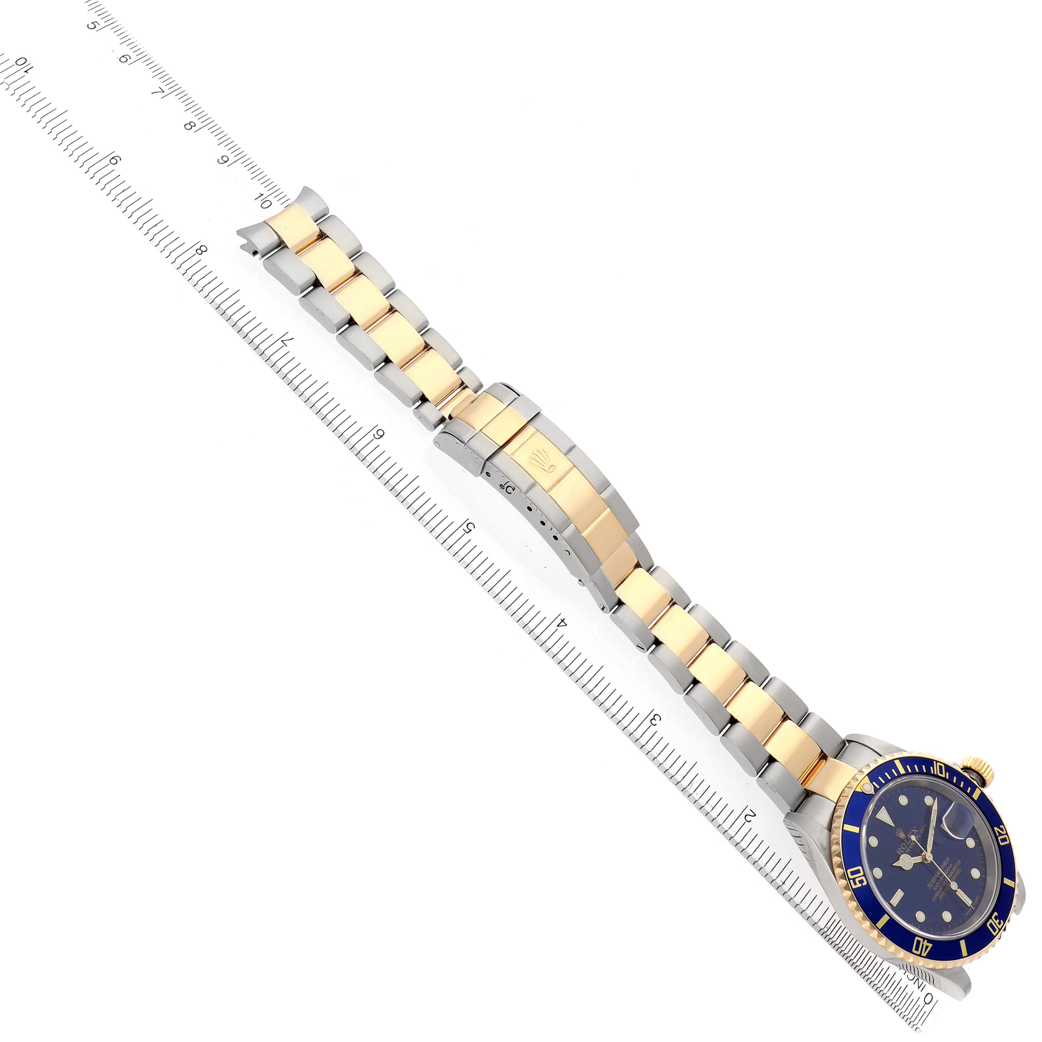The Rolex Submariner 16613 Men
s Steel and Gold (two tone) Blue Dial watch is shown from an overhead angle, displaying the bracelet, clasp, and bezel.