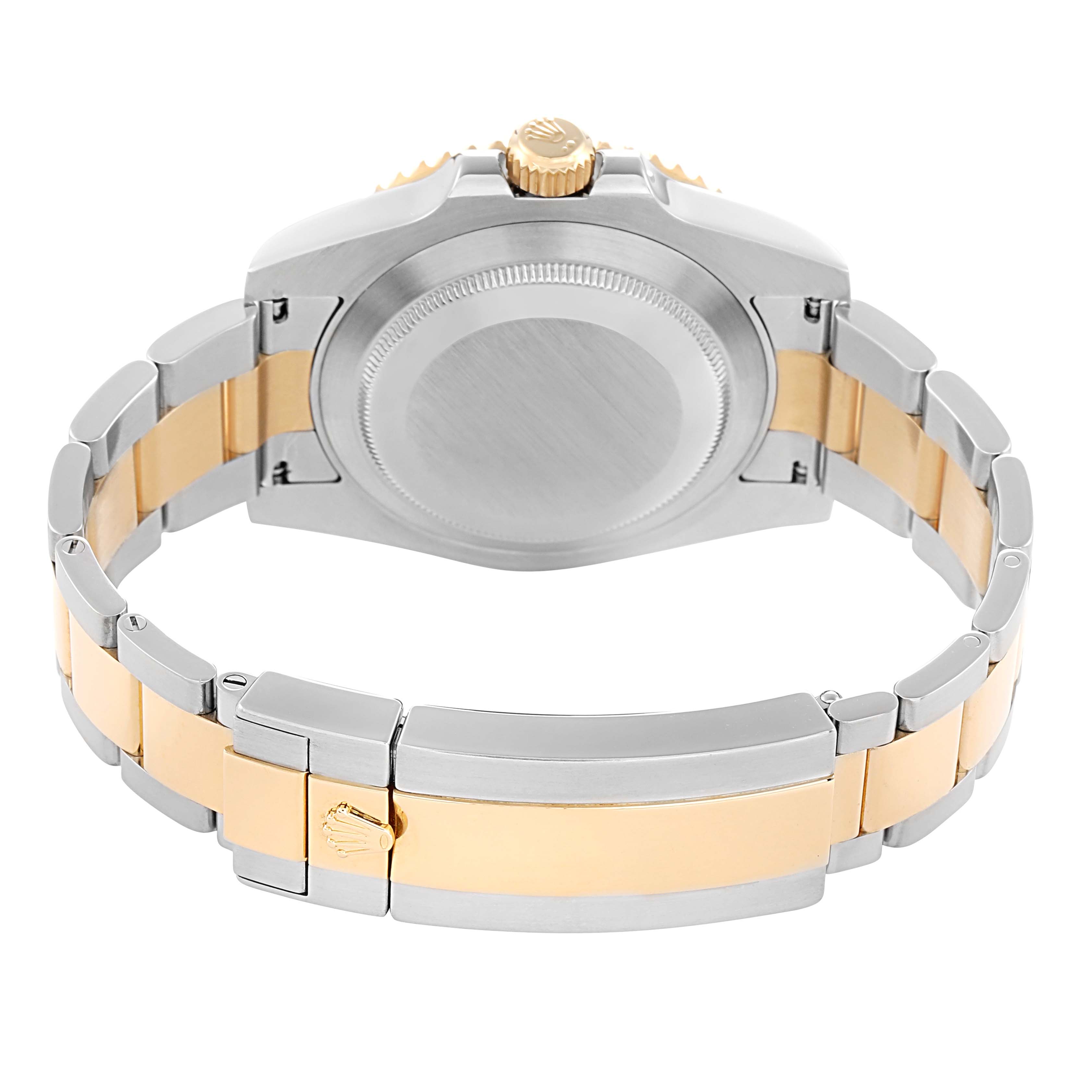 The image shows the backside and bracelet of a Rolex Submariner 116613 Men
s Steel and Gold (two tone) Blue Dial, highlighting the two-tone metal links and clasp.