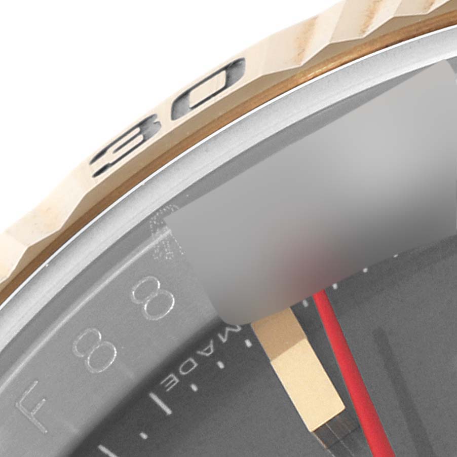 The image shows a close-up of the bezel and part of the dial of the Rolex Turn-o-Graph 116263 Men
s Steel and Gold (two tone) Grey Dial 116263 Men
s Steel and Gold (two tone) Grey Dial watch.