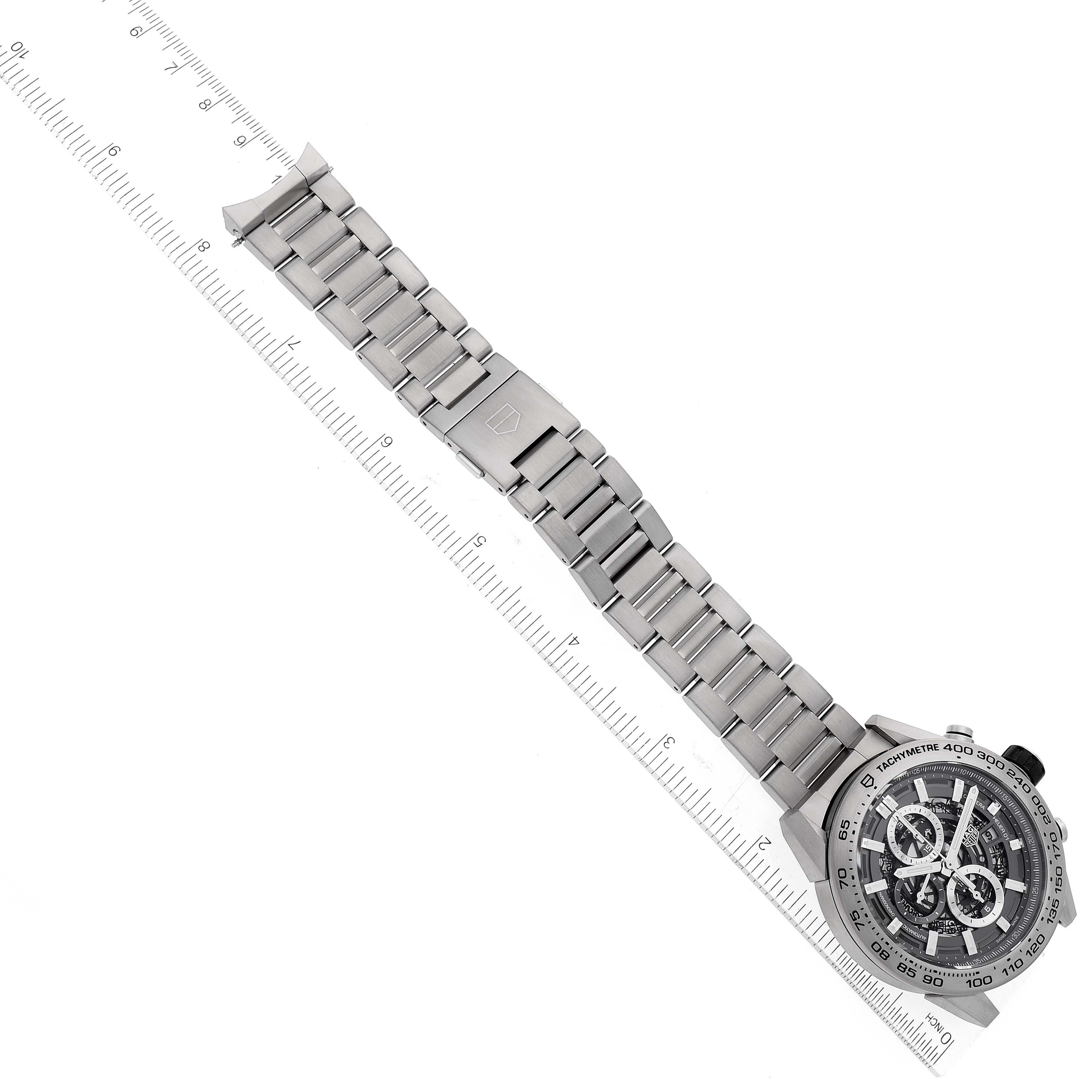 This image shows the front angle of a Tag Heuer Carrera CAR2A8A.BF0707 Men's Titanium Grey Dial CAR2A8A.BF0707 Men's Titanium Grey Dial watch with its full metal bracelet aligned over a ruler.