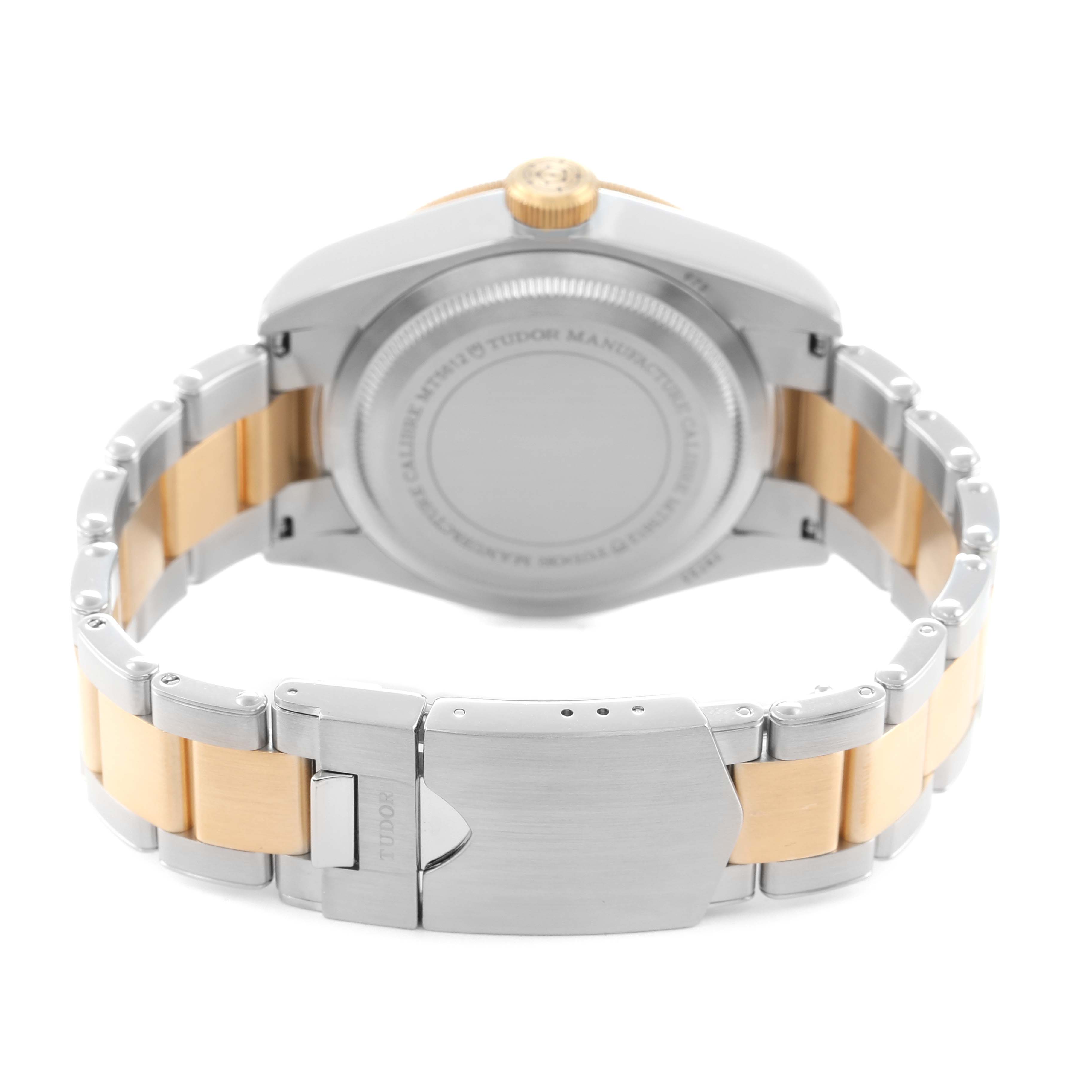 The image shows the back of the Tudor Heritage Black Bay 79733 Men
s Steel and Gold (two tone) Black Dial watch, including its bracelet and clasp.