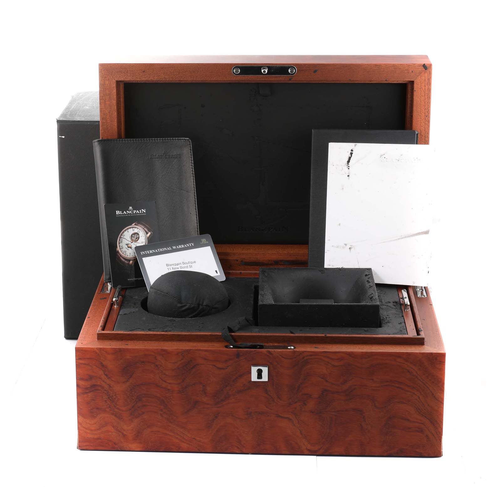 The image shows a Blancpain Villeret 6659-3631-55B Men's Rose Gold White Dial 6659-3631-55B Men's Rose Gold White Dial watch box with accompanying accessories, including a booklet, international warranty card, and storage compartments.