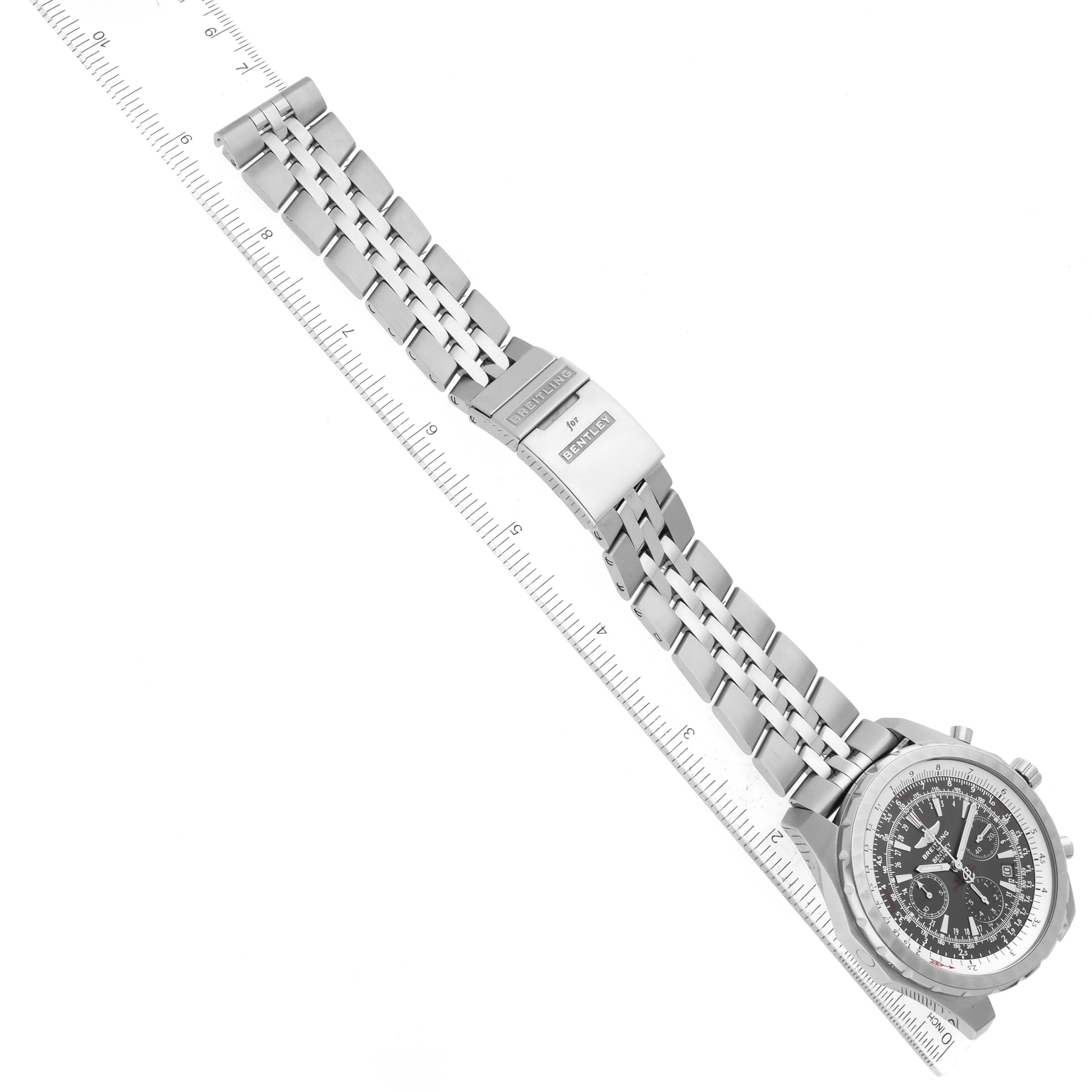 The Bentley model by Breitling is shown at an angle, displaying the watch face, bezel, bracelet, and clasp alongside a ruler.
