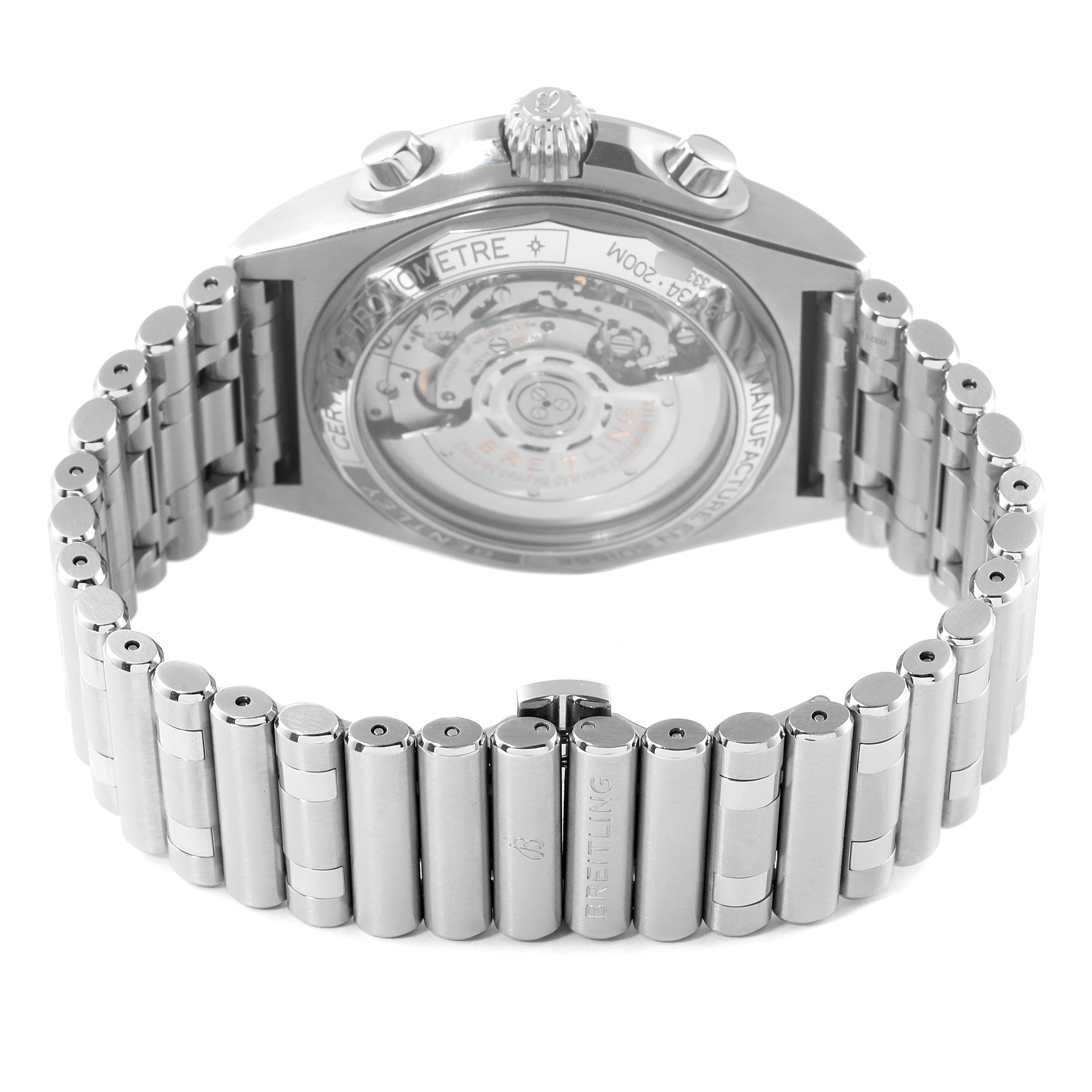 The image shows the back and bracelet of a Breitling Chronomat AB01343A1L1A1 Men's Stainless Steel Green Dial AB01343A1L1A1 Men's Stainless Steel Green Dial watch at an angle, highlighting its transparent case back and metal links.