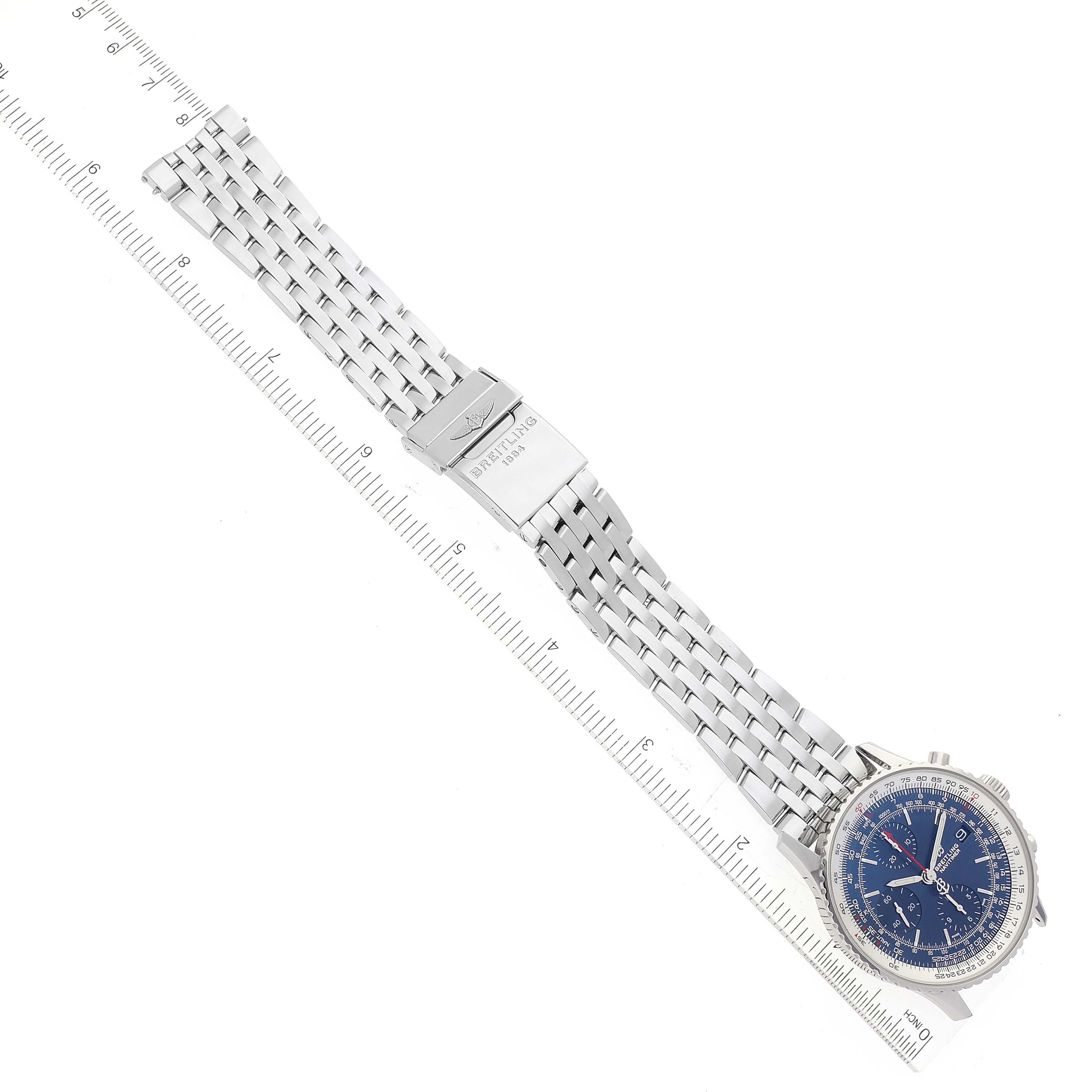 The image shows a Breitling Navitimer A13324 Men
s Stainless Steel Blue Dial A13324 Men
s Stainless Steel Blue Dial watch laid flat, displaying the face, bracelet, and clasp with a ruler for scale.