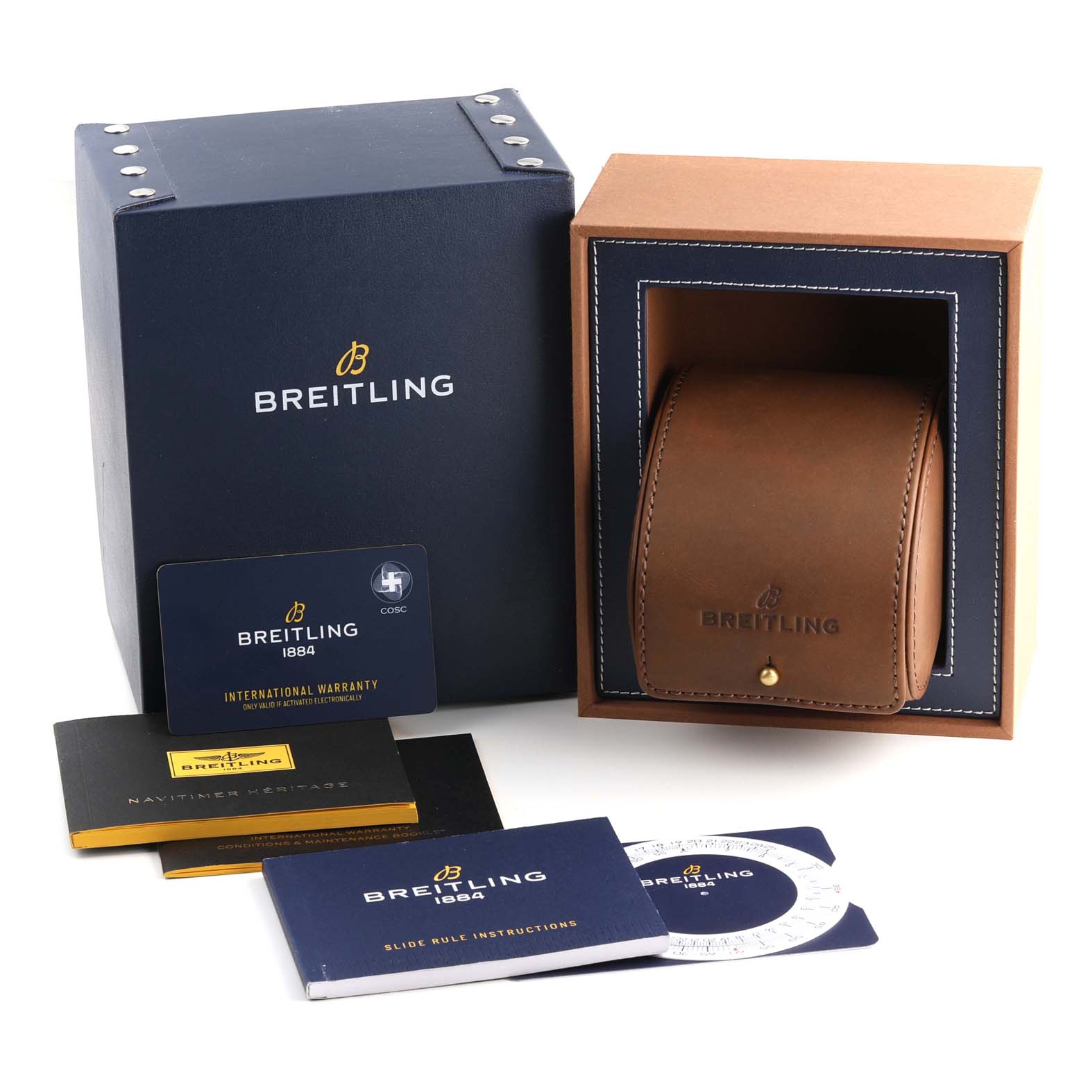 The image shows a Breitling Navitimer A13324 Men
s Stainless Steel Blue Dial A13324 Men
s Stainless Steel Blue Dial watch box, a leather case, warranty cards, and instruction booklets from various angles.