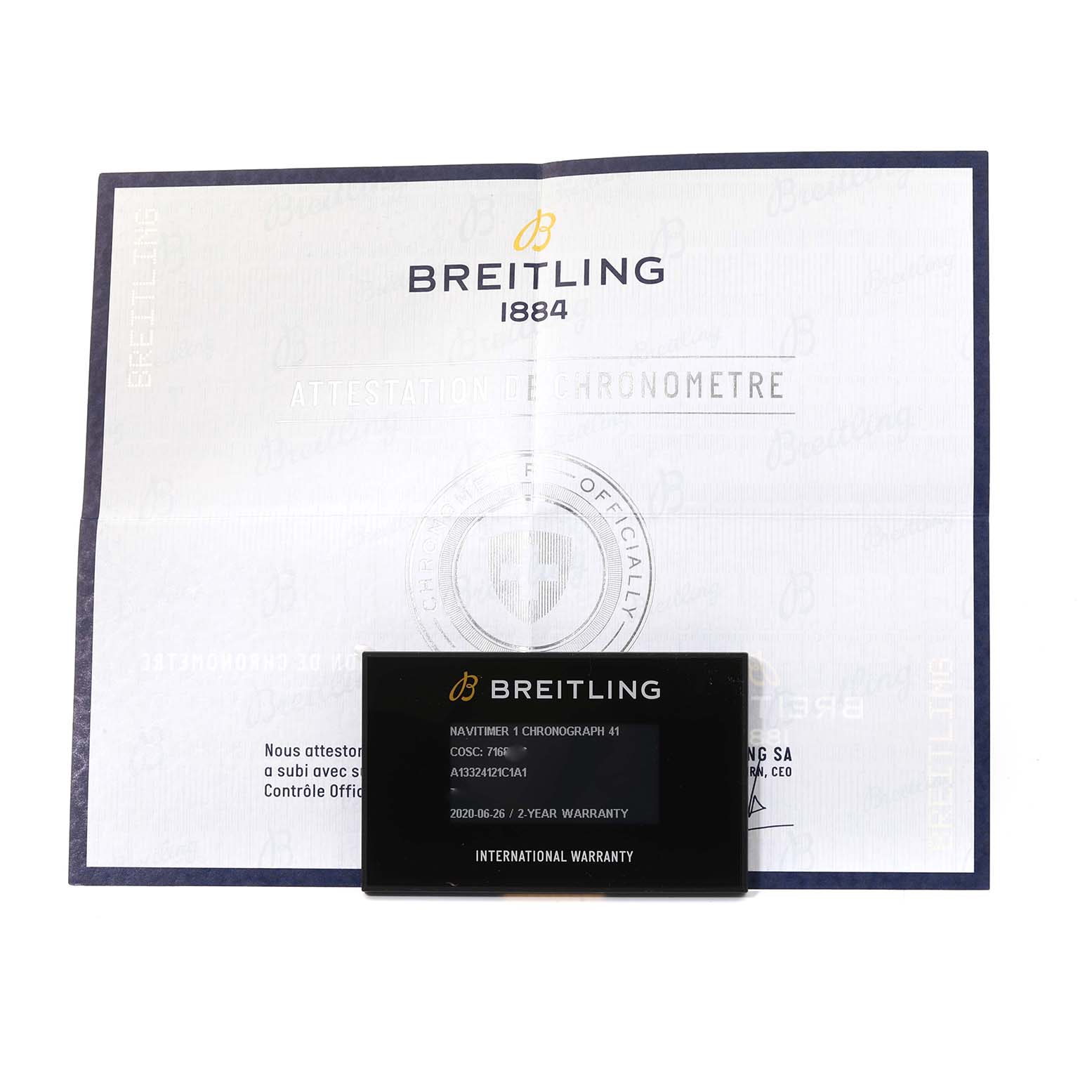 The image shows the warranty card and certificate for a Breitling Navitimer A13324 Men's Stainless Steel Blue Dial A13324 Men's Stainless Steel Blue Dial model, with a view from the top.