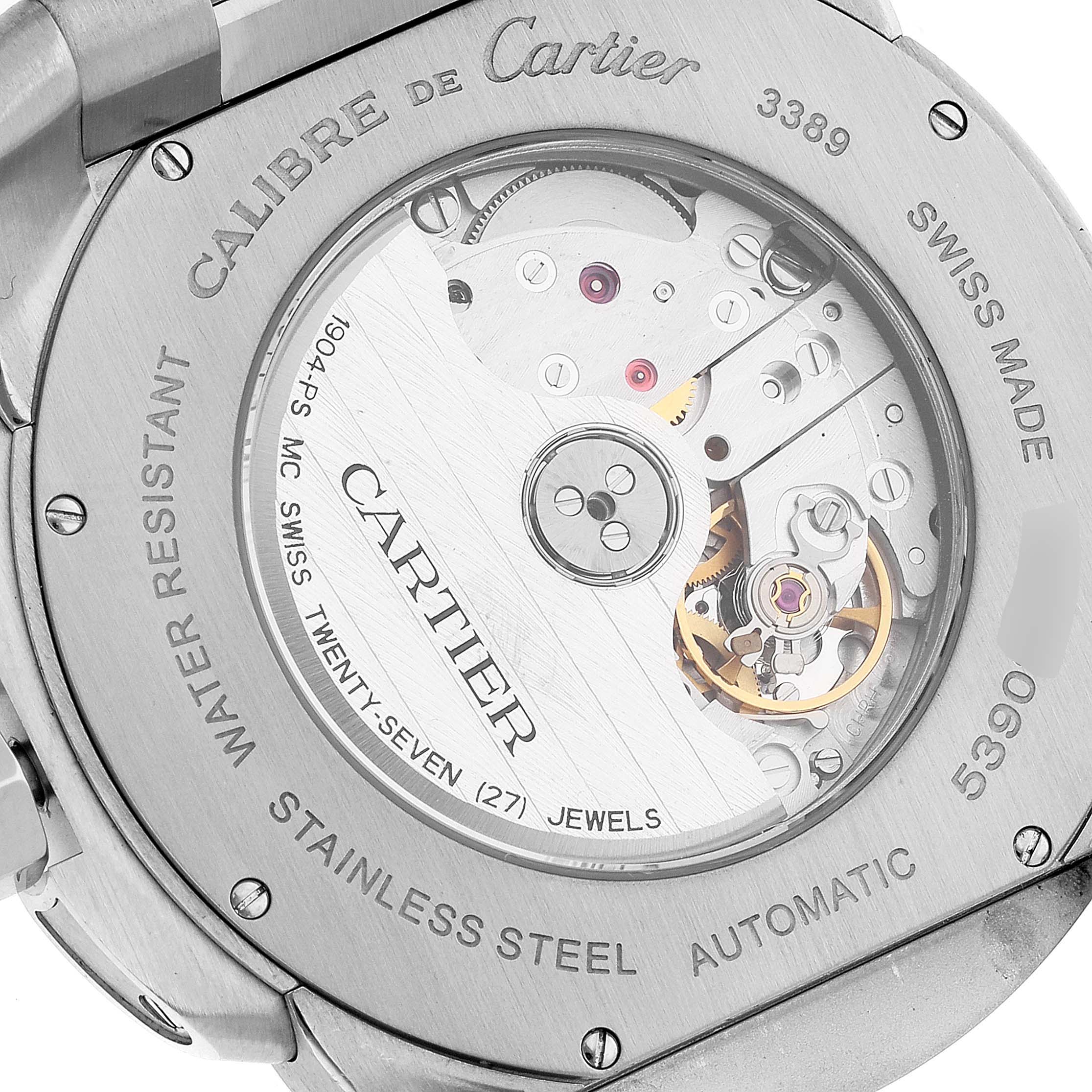 The image shows the back case and internal mechanism of a Calibre de Cartier watch by Cartier from a close-up angle.