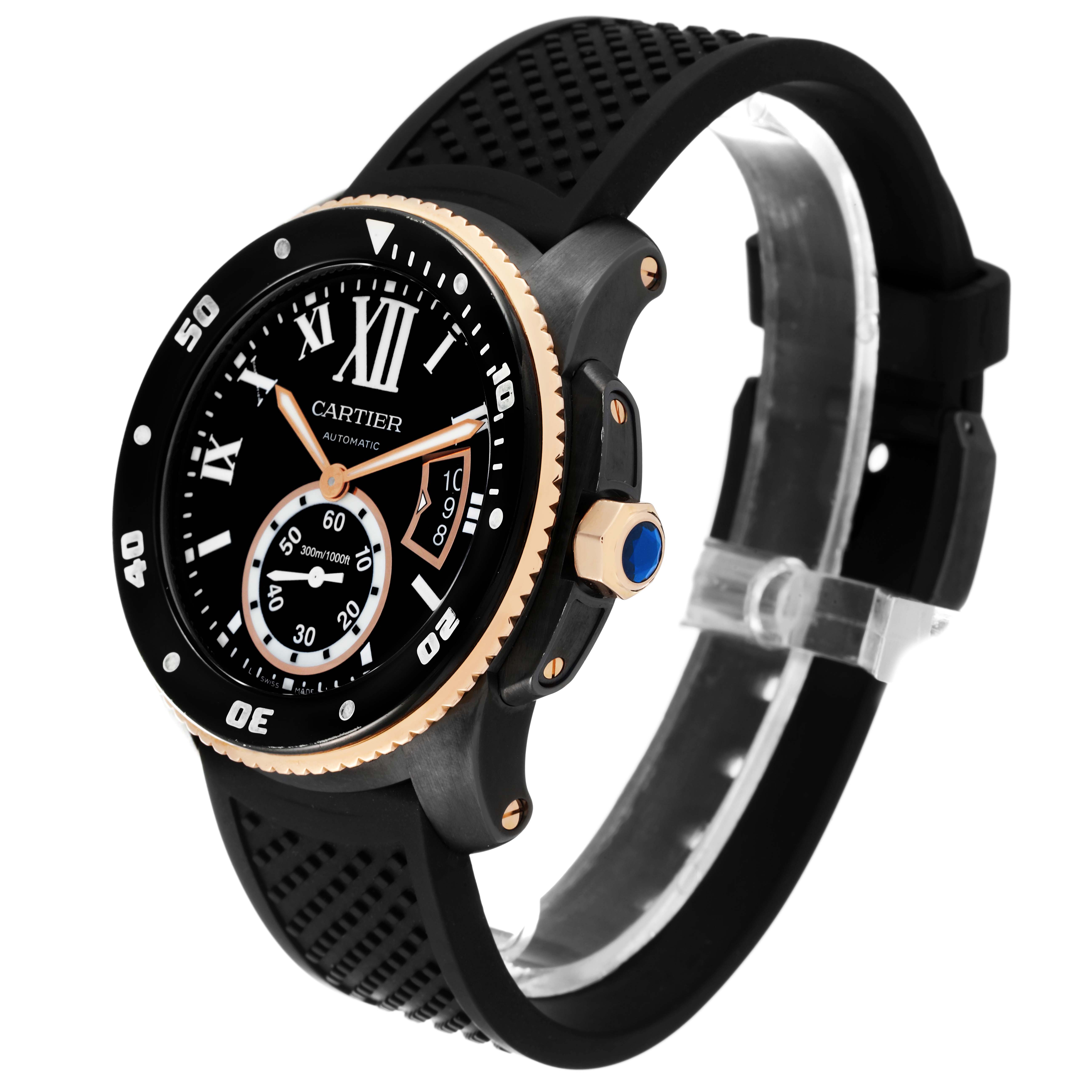 The image shows a Calibre de Cartier watch by Cartier at an angled view, highlighting its black dial, bezel, crown, and rubber strap.