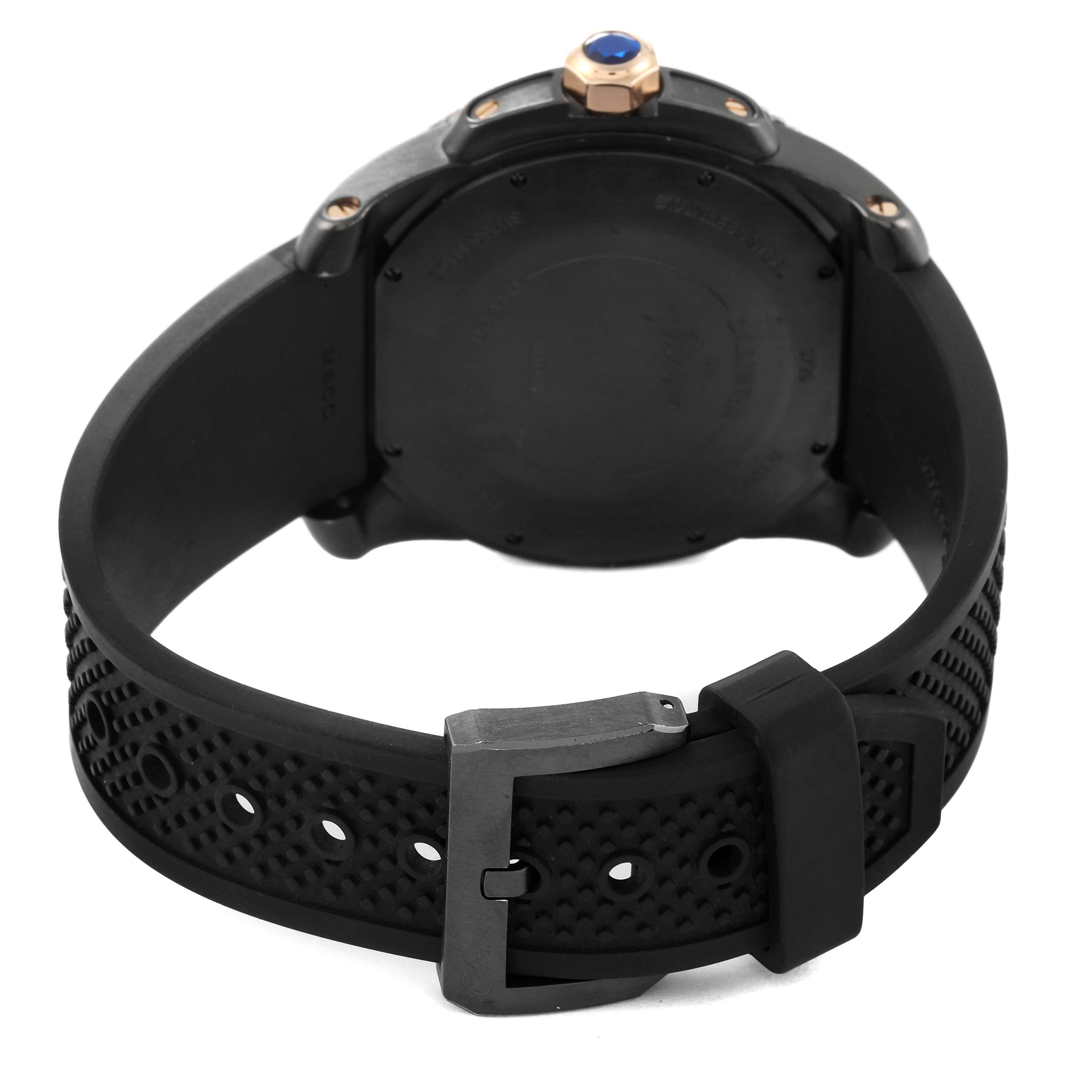 The Calibre de Cartier watch is shown from the rear, displaying its back case, black strap, and buckle.