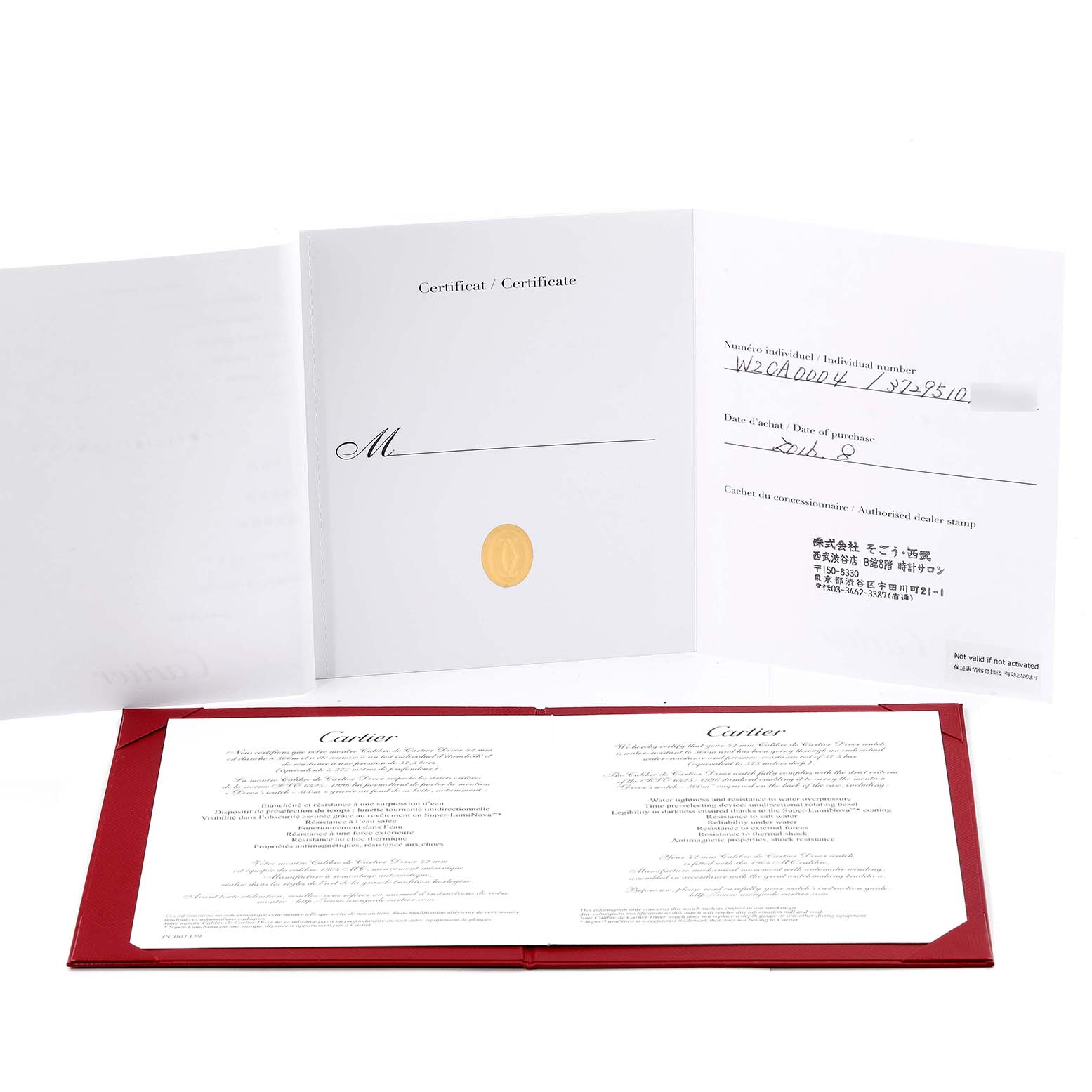The image displays the certificate and warranty card for the Calibre de Cartier watch by Cartier, shown open on a flat surface.