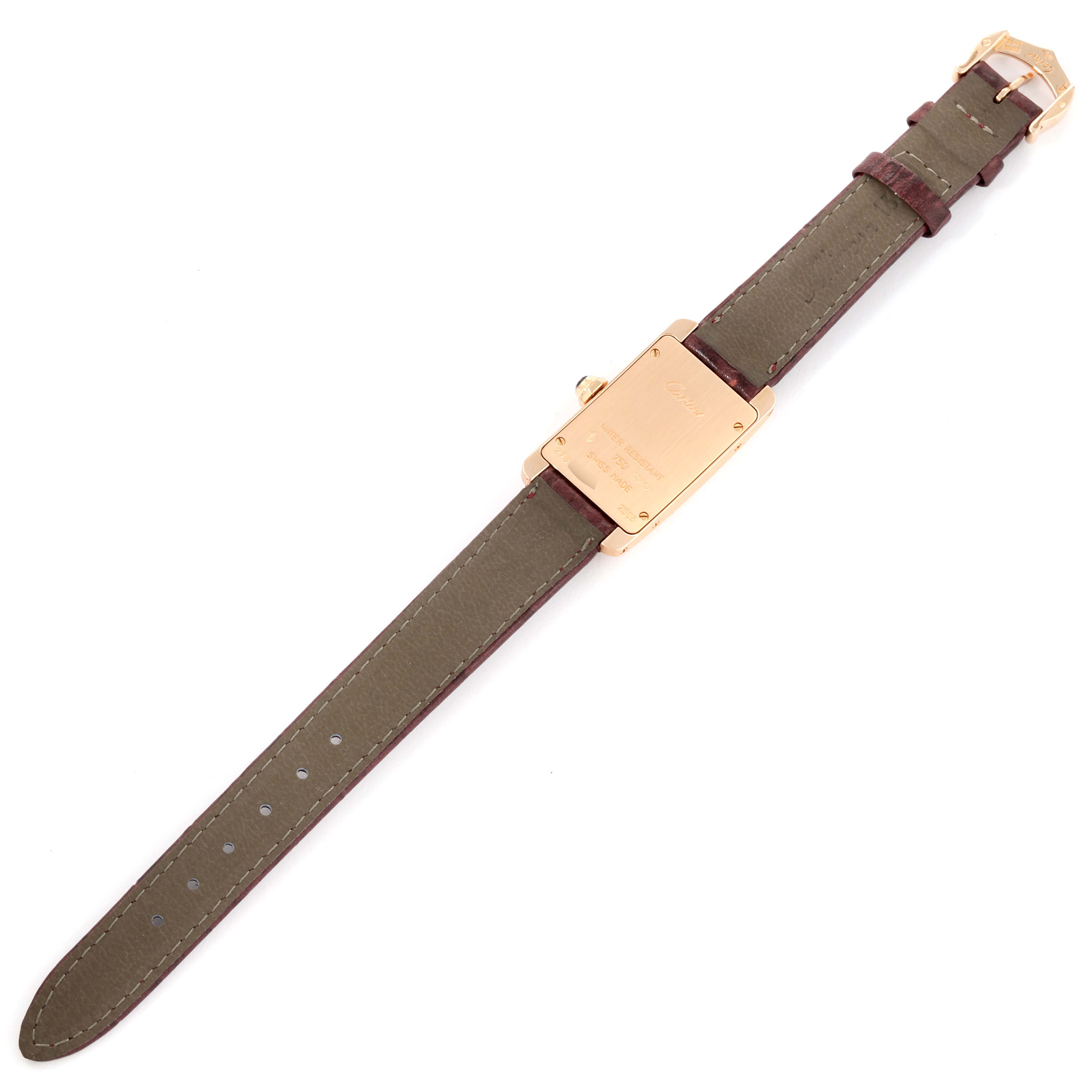 This image shows the back view of a Cartier Tank Americaine W2607056 Women's Rose Gold Silver Dial W2607056 Women's Rose Gold Silver Dial watch, highlighting the caseback and the leather strap.