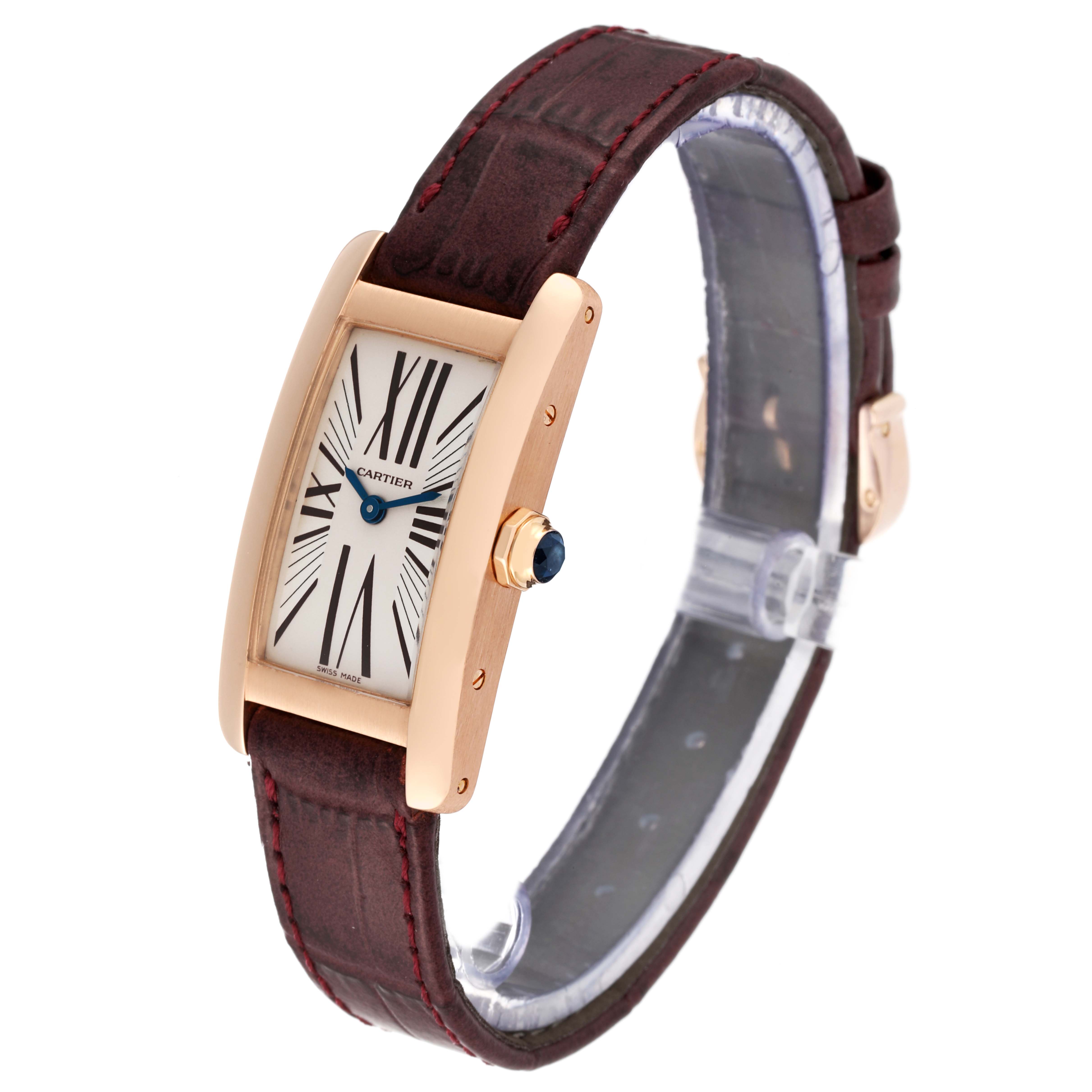 The image shows a Cartier Tank Américaine watch at a three-quarter angle, highlighting its rectangular face and leather strap.