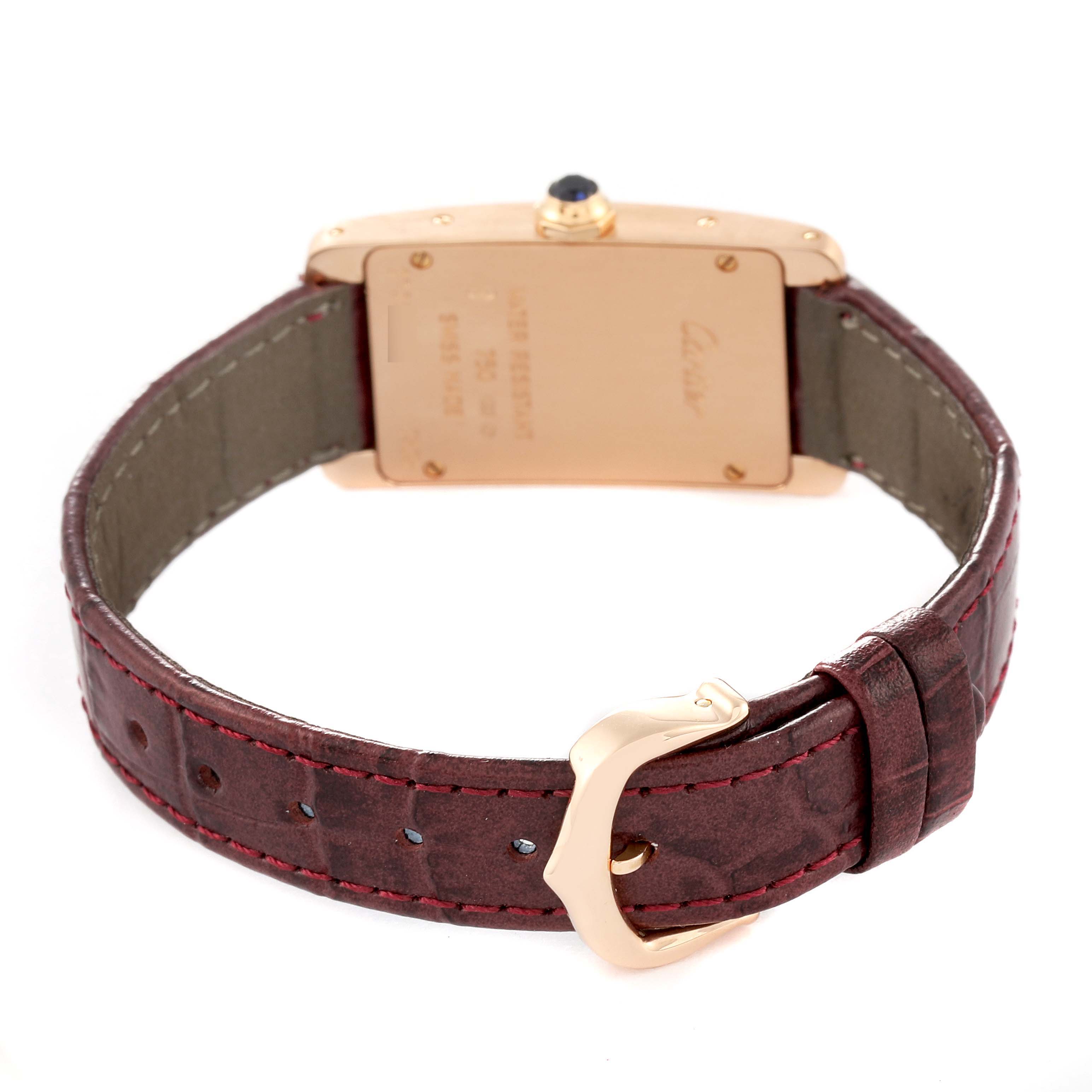 The image shows the backside and strap of a Cartier Tank Americaine W2607056 Women's Rose Gold Silver Dial W2607056 Women's Rose Gold Silver Dial watch, highlighting the buckle and case back.