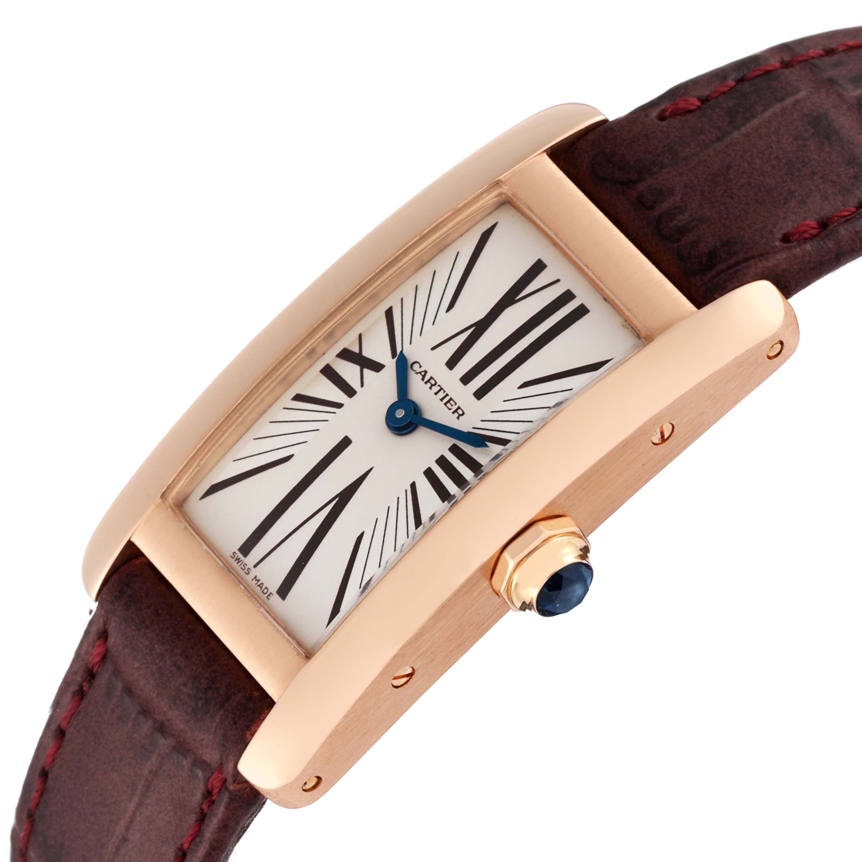 The Cartier Tank Americaine W2607056 Women's Rose Gold Silver Dial W2607056 Women's Rose Gold Silver Dial watch is shown at an angled close-up, highlighting the dial, blue hands, crown, and part of the leather strap.