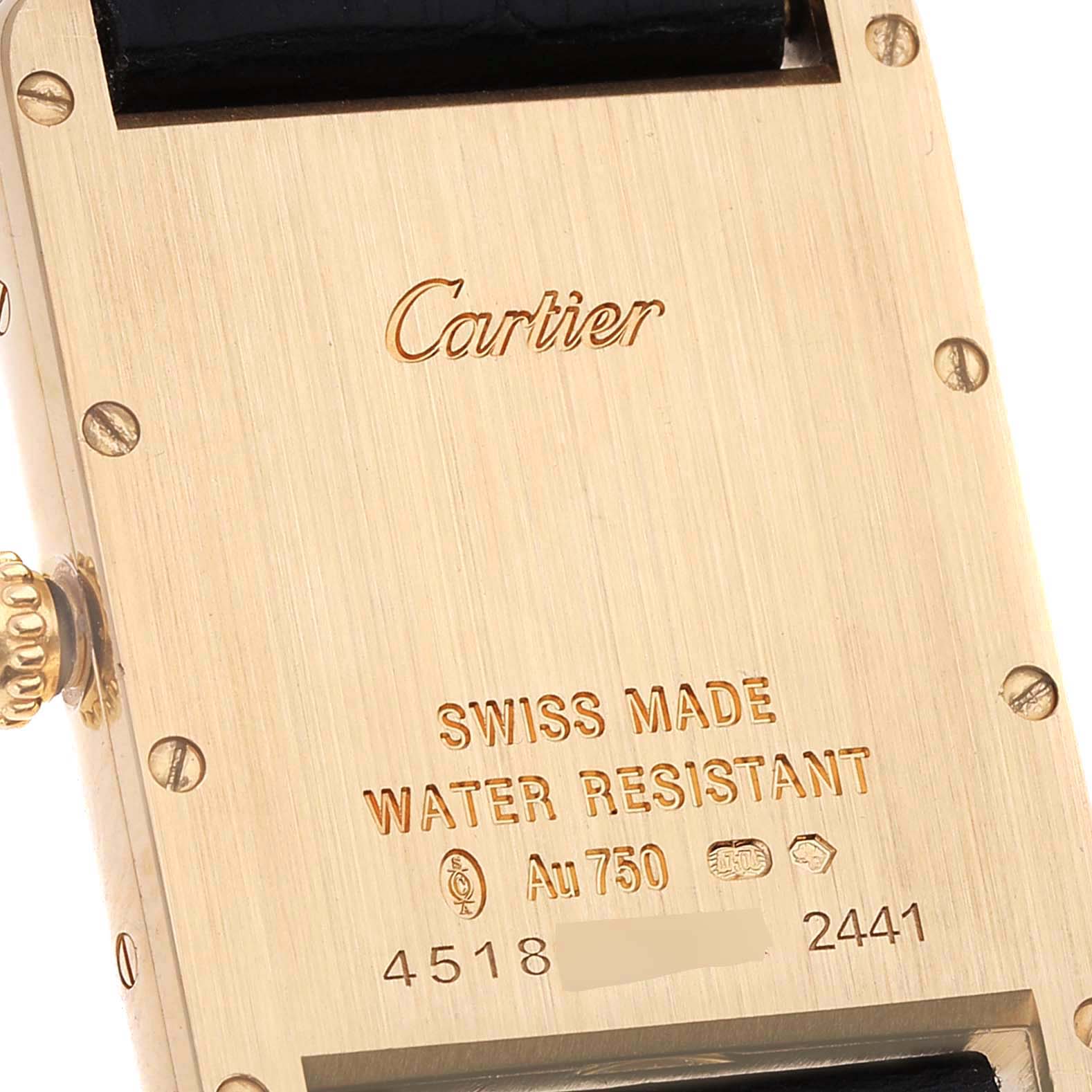 The image shows the backside of a Tank Louis model by Cartier, highlighting the branding, serial number, and water resistance details.