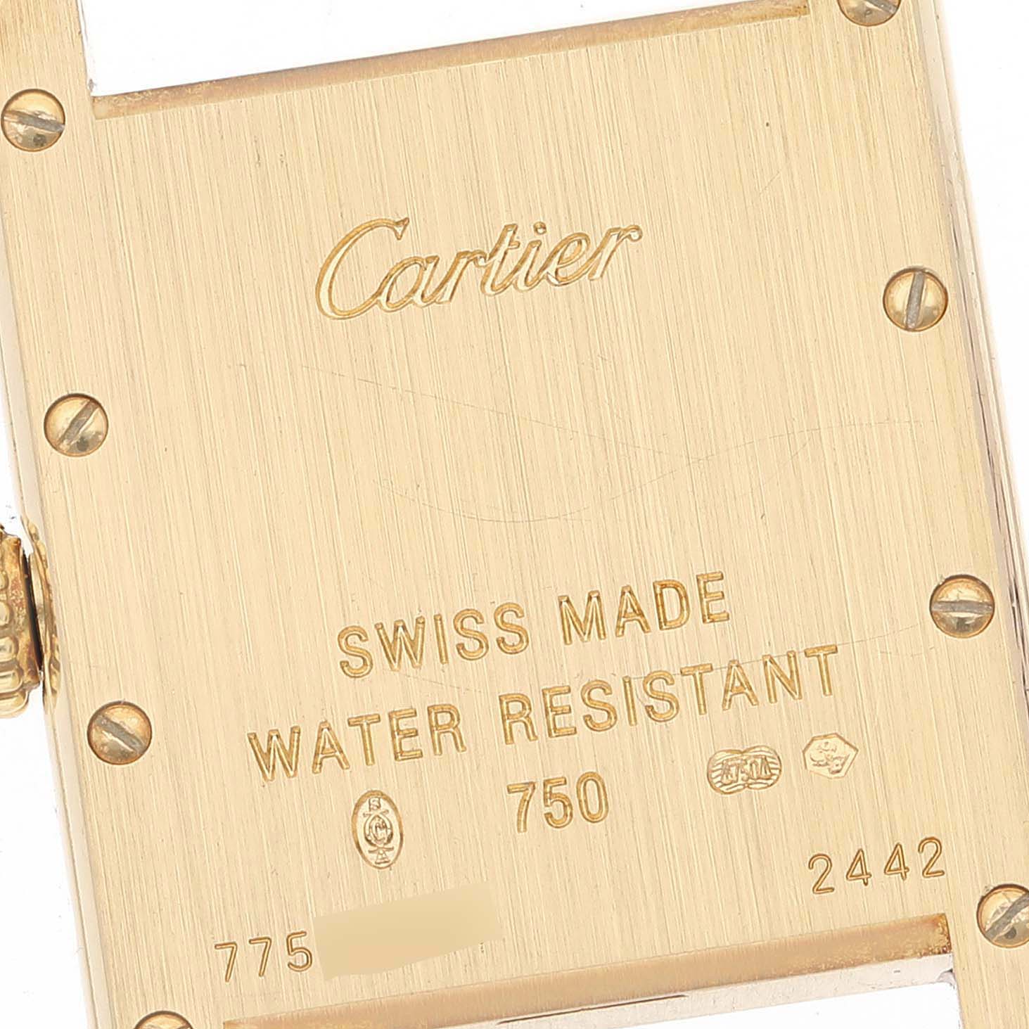 The image shows the back case of the Cartier Tank Louis W1529856 Women's Yellow Gold Silver Dial W1529856 Women's Yellow Gold Silver Dial watch, highlighting its engravings and screws.