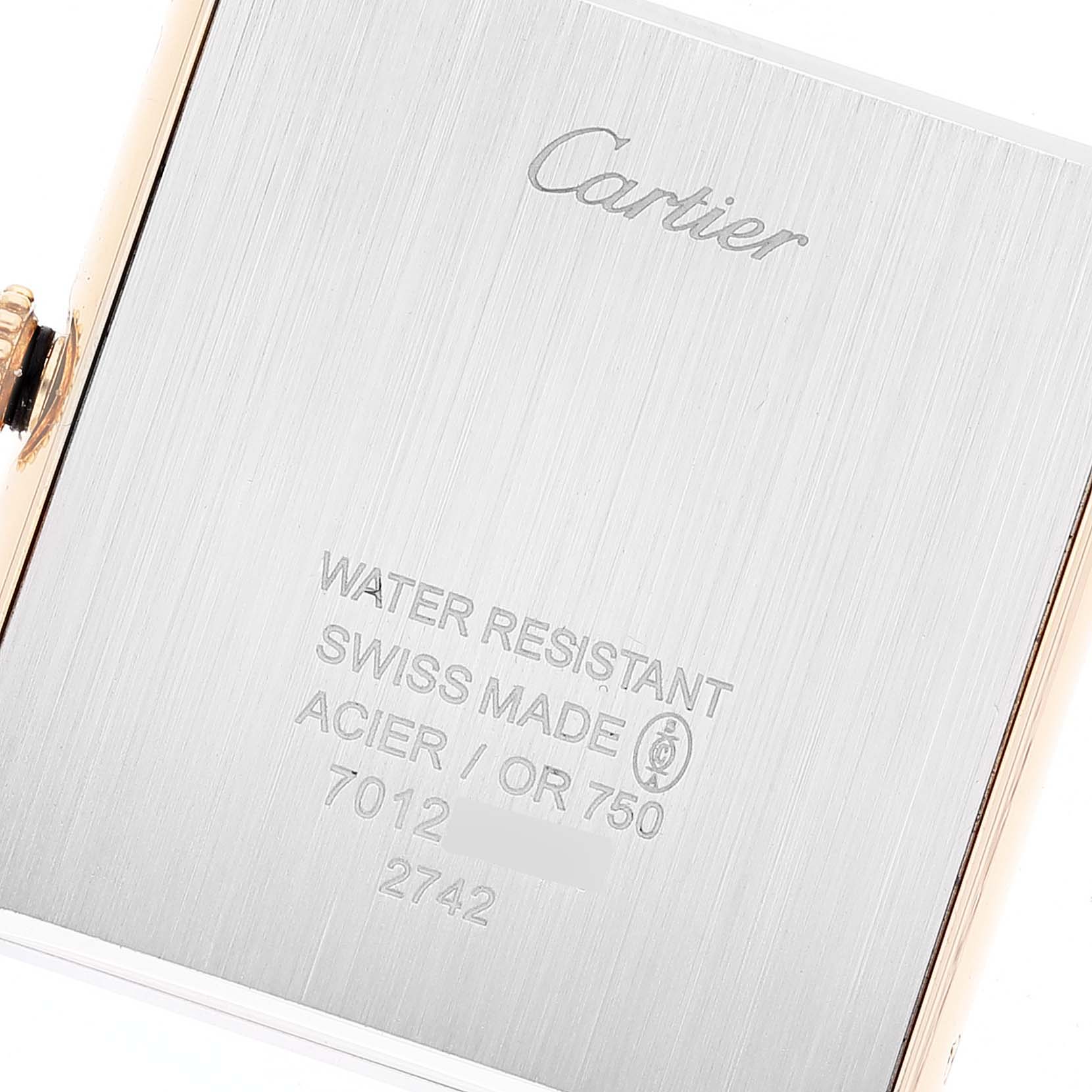 This image shows the back of a Cartier Tank Solo W1018855 Men
s Yellow Gold Silver Dial W1018855 Men
s Yellow Gold Silver Dial watch, featuring engraved specifications and branding.