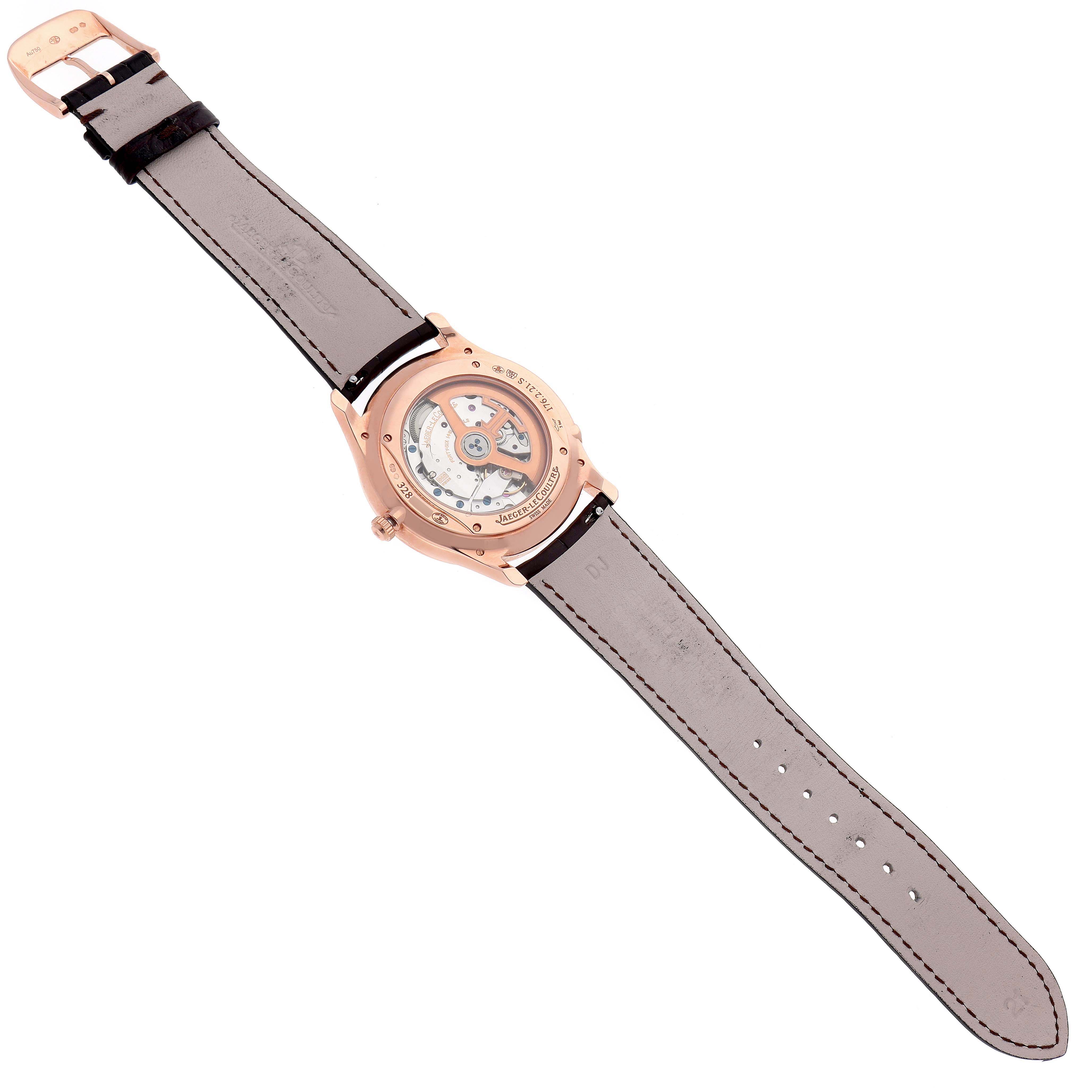 The image shows the back view of a Jaeger LeCoultre Master Q1302501 Men
s Rose Gold Silver Dial Q1302501 Men
s Rose Gold Silver Dial model watch, highlighting the movement and leather strap.
