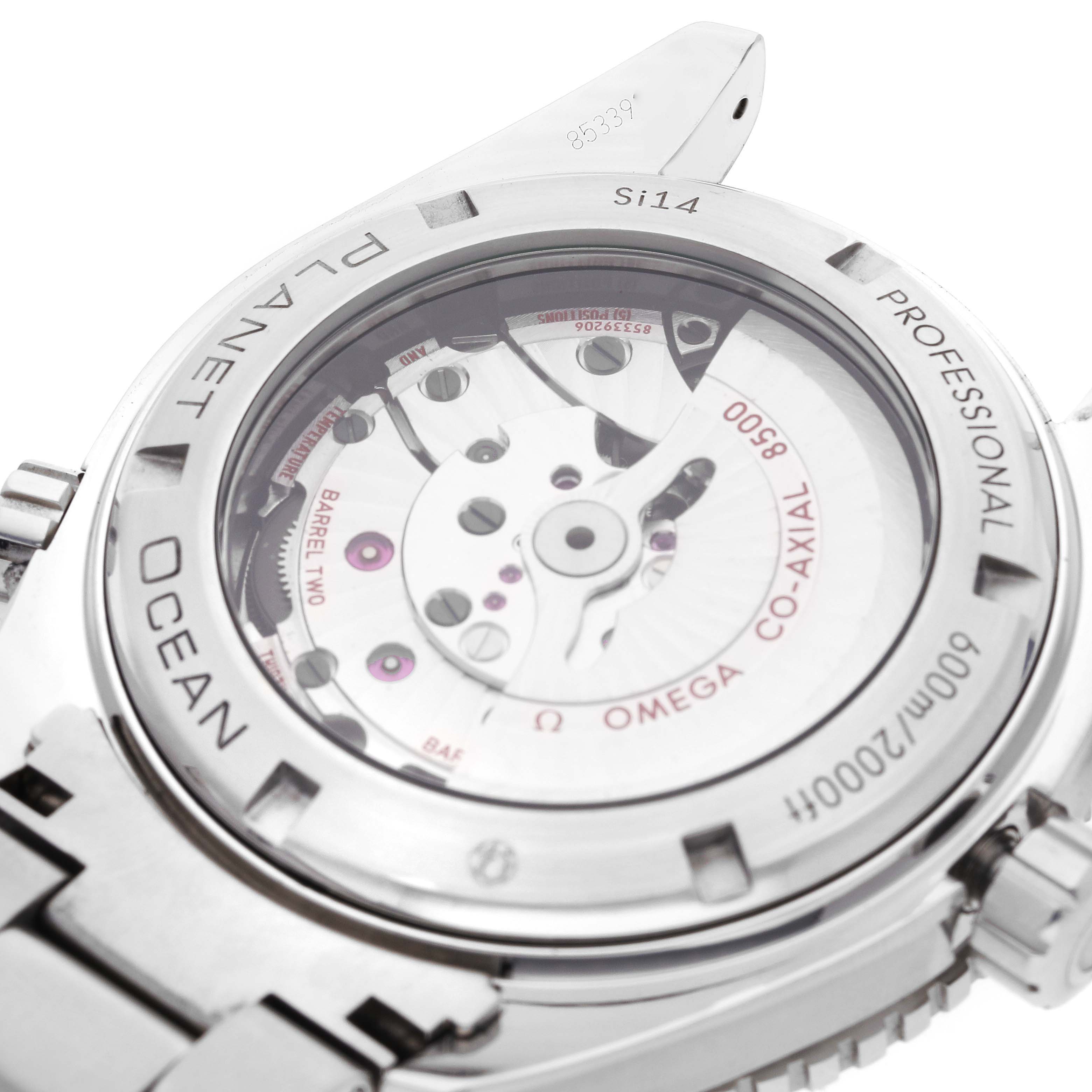 The image shows the rear view of an Omega Planet Ocean 232.30.46.21.01.001 Men
s Stainless Steel Black Dial 232.30.46.21.01.001 Men
s Stainless Steel Black Dial watch, highlighting its transparent case back and internal mechanism.