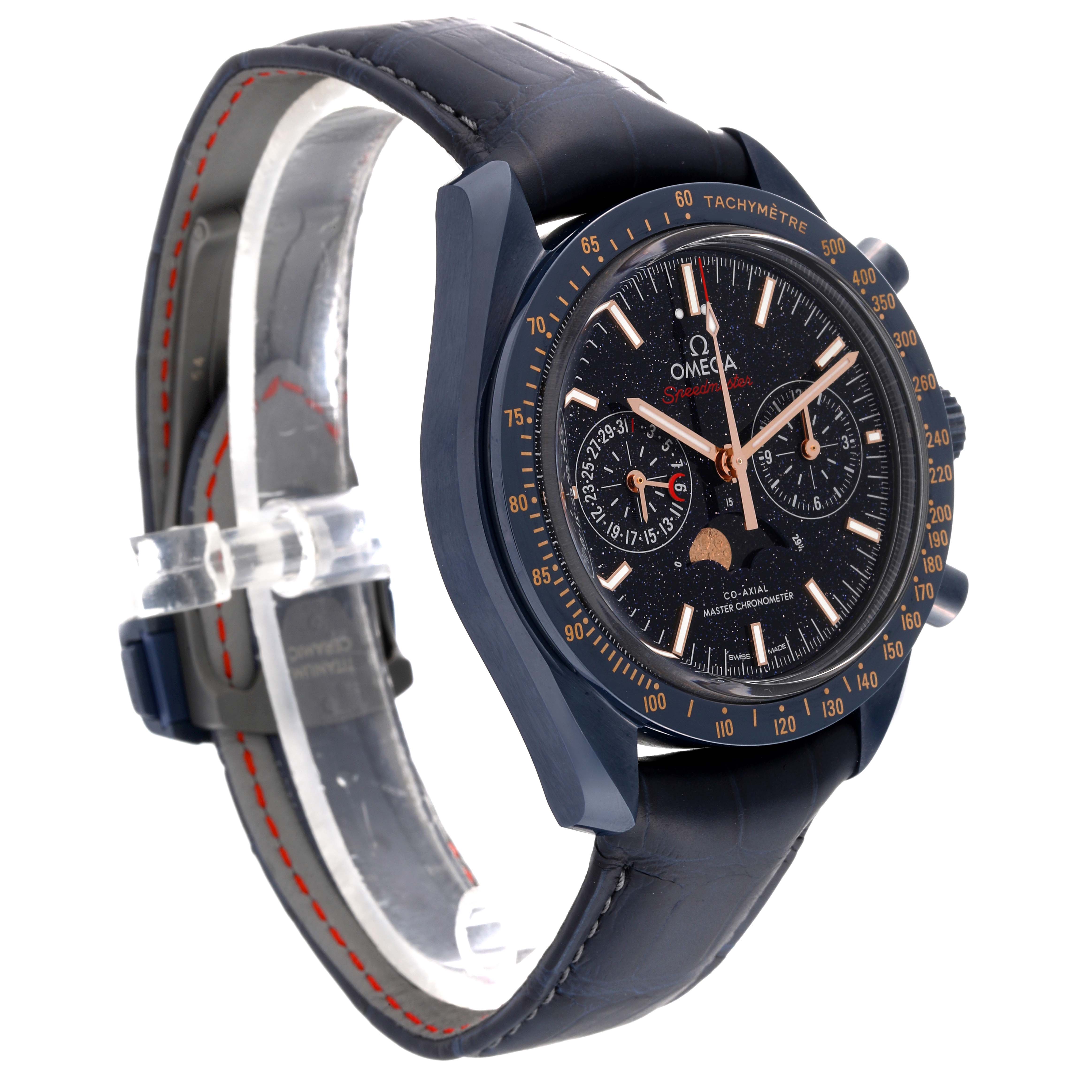 The Omega Speedmaster 304.93.44.52.03.002 Men's Ceramic Blue Dial 304.93.44.52.03.002 Men's Ceramic Blue Dial watch is shown at a 3/4 angle with detailed views of the dial, tachymeter bezel, and leather strap.