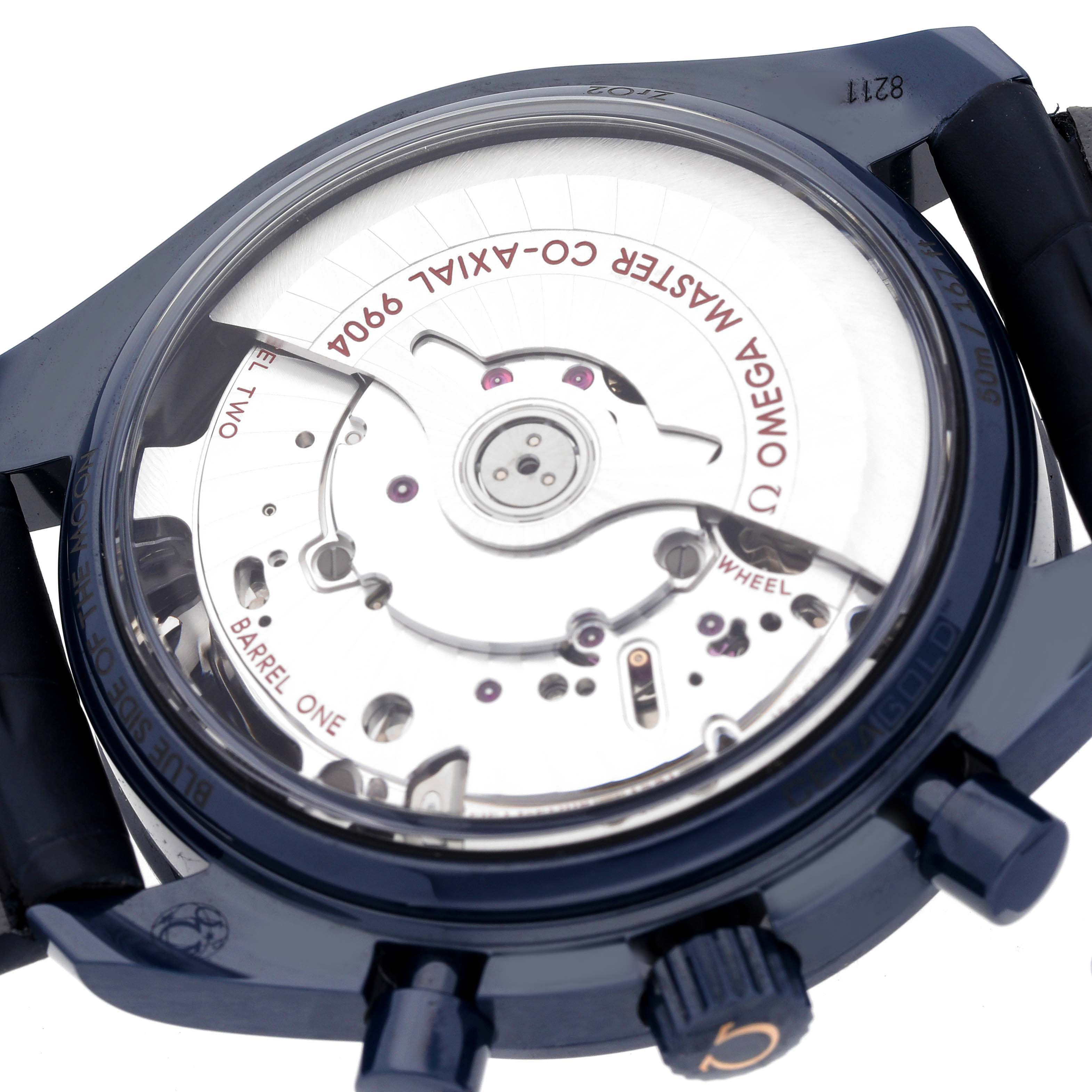 This image shows the back view of the Omega Speedmaster 304.93.44.52.03.002 Men's Ceramic Blue Dial 304.93.44.52.03.002 Men's Ceramic Blue Dial, highlighting its movement and internal mechanisms.