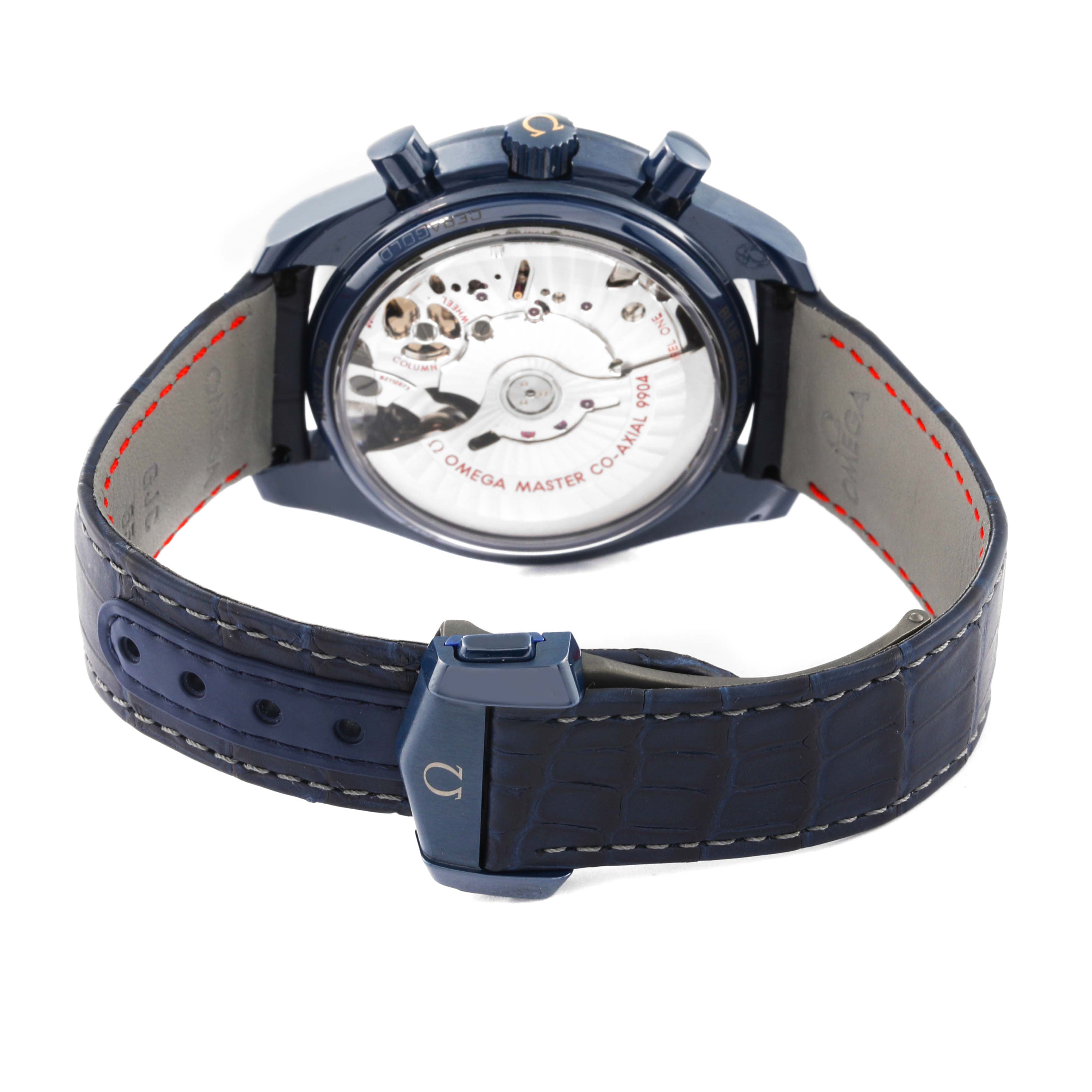 The image shows the back view of an Omega Speedmaster 304.93.44.52.03.002 Men's Ceramic Blue Dial 304.93.44.52.03.002 Men's Ceramic Blue Dial watch, revealing the movement through its transparent case back and leather strap.