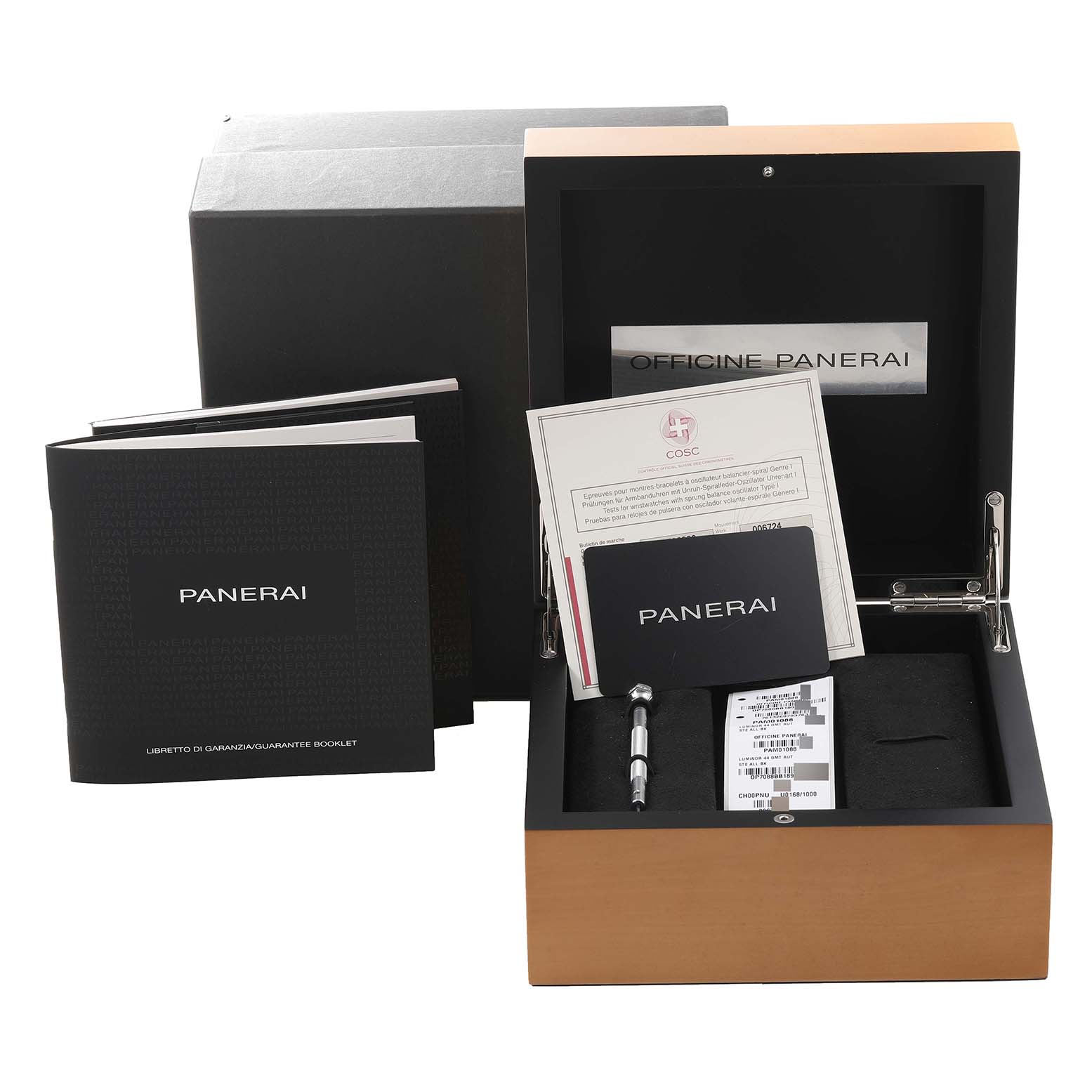 This image shows packaging and accessories, including manuals and a screwdriver, for the Panerai Luminor PAM01088 Men
s Stainless Steel Black Dial PAM01088 Men
s Stainless Steel Black Dial watch.