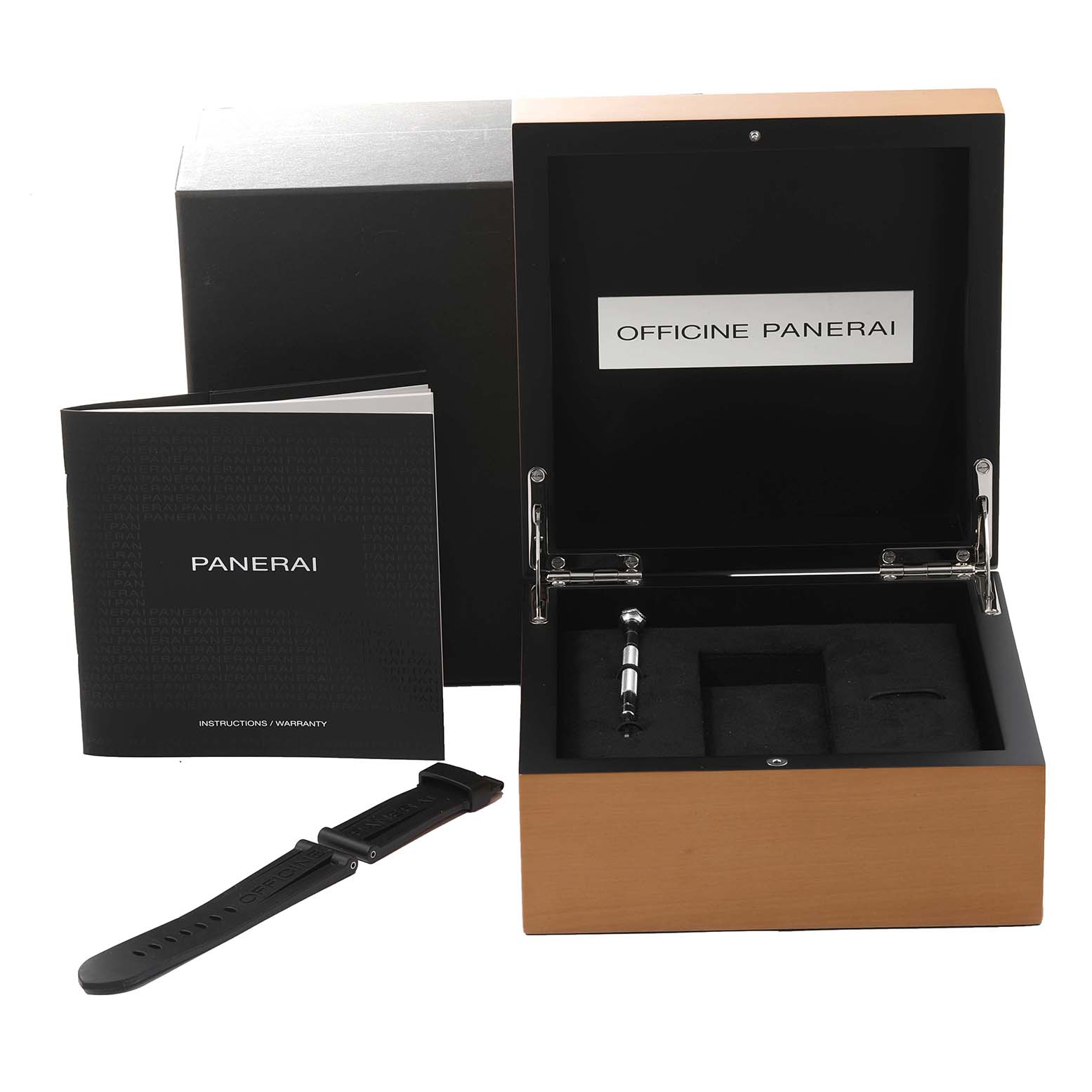 The image shows the box, an extra strap, a tool, and an instruction/warranty booklet for a Panerai Luminor PAM00796 Men
s Stainless Steel Black Dial PAM00796 Men
s Stainless Steel Black Dial watch.