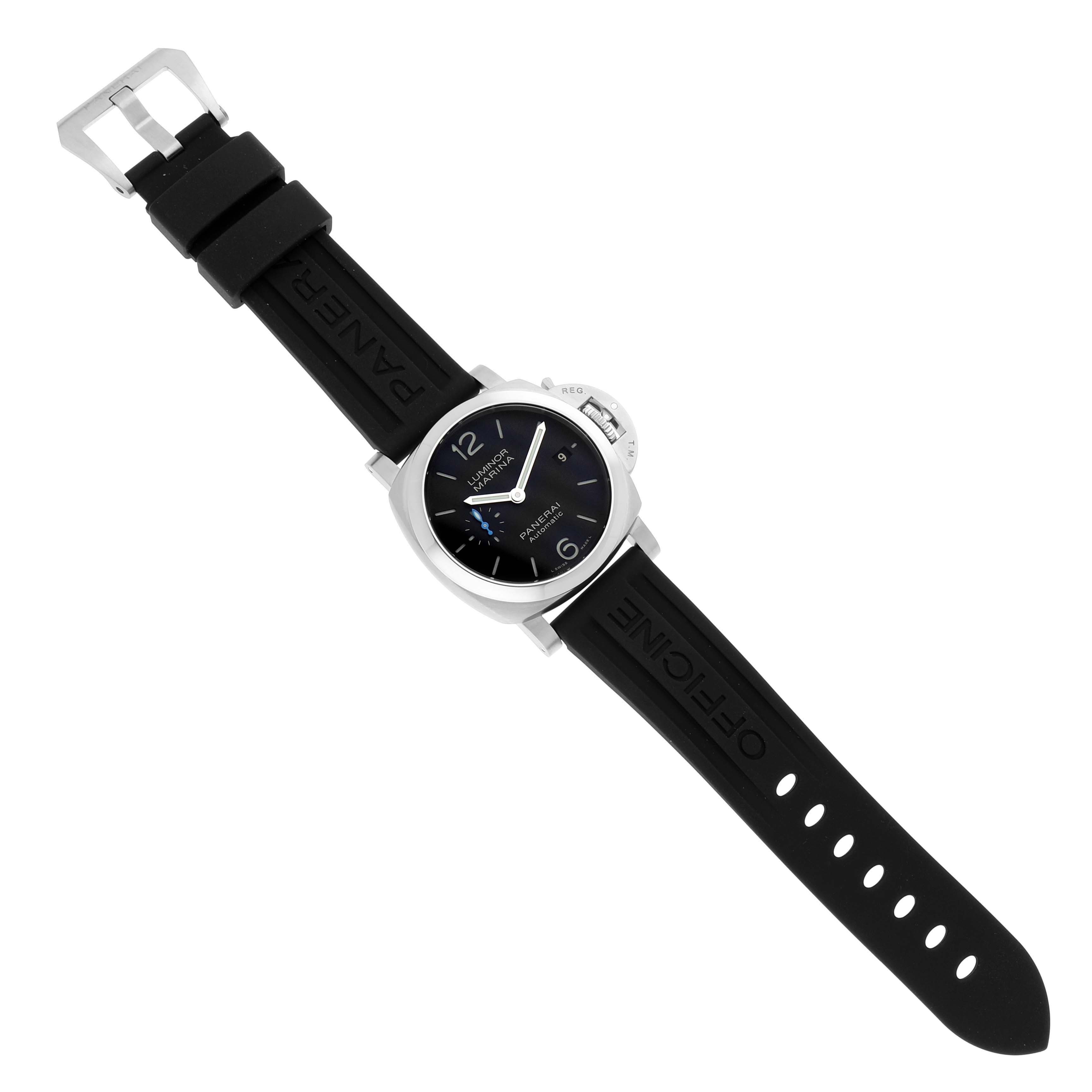 The image shows a top view of a Panerai Luminor PAM01372 Men
s Stainless Steel Black Dial PAM01372 Men
s Stainless Steel Black Dial watch, highlighting its black rubber strap, silver case, and blue dial details.