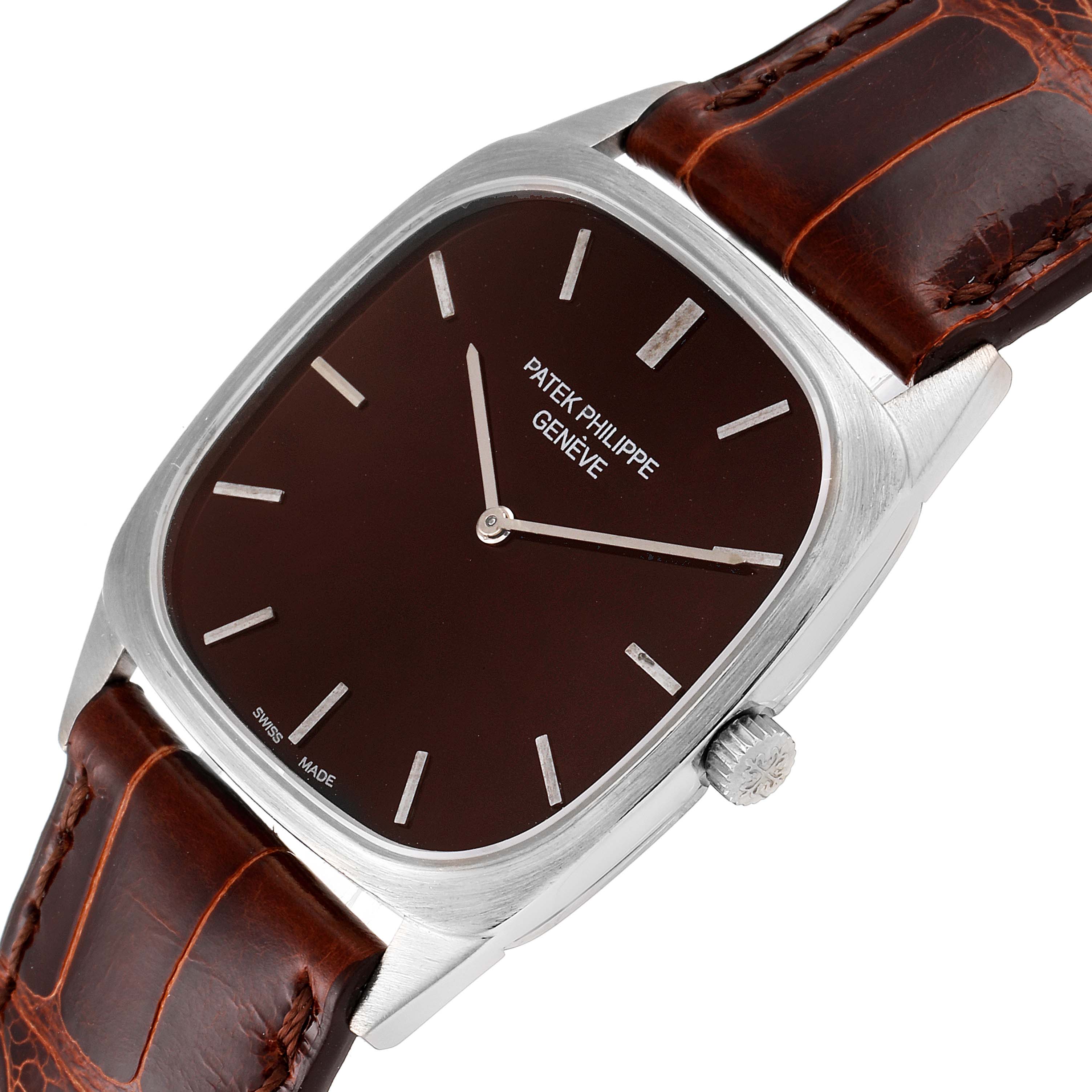 This is a Vintage Patek Philippe watch shown from a slightly angled top-down view, displaying its face, bezel, and part of the strap.