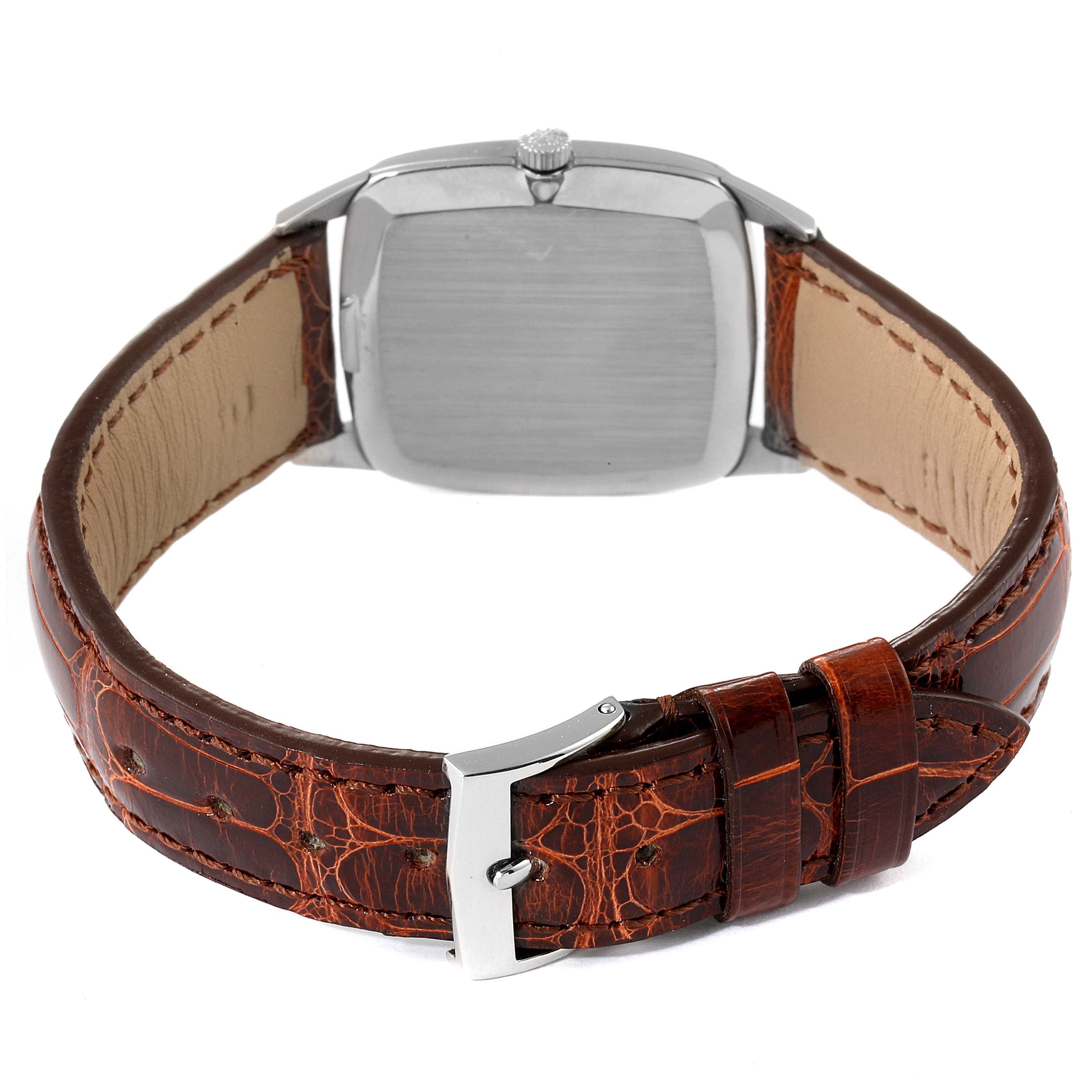 The image shows the back view of a Vintage Patek Philippe watch with a brown leather strap.