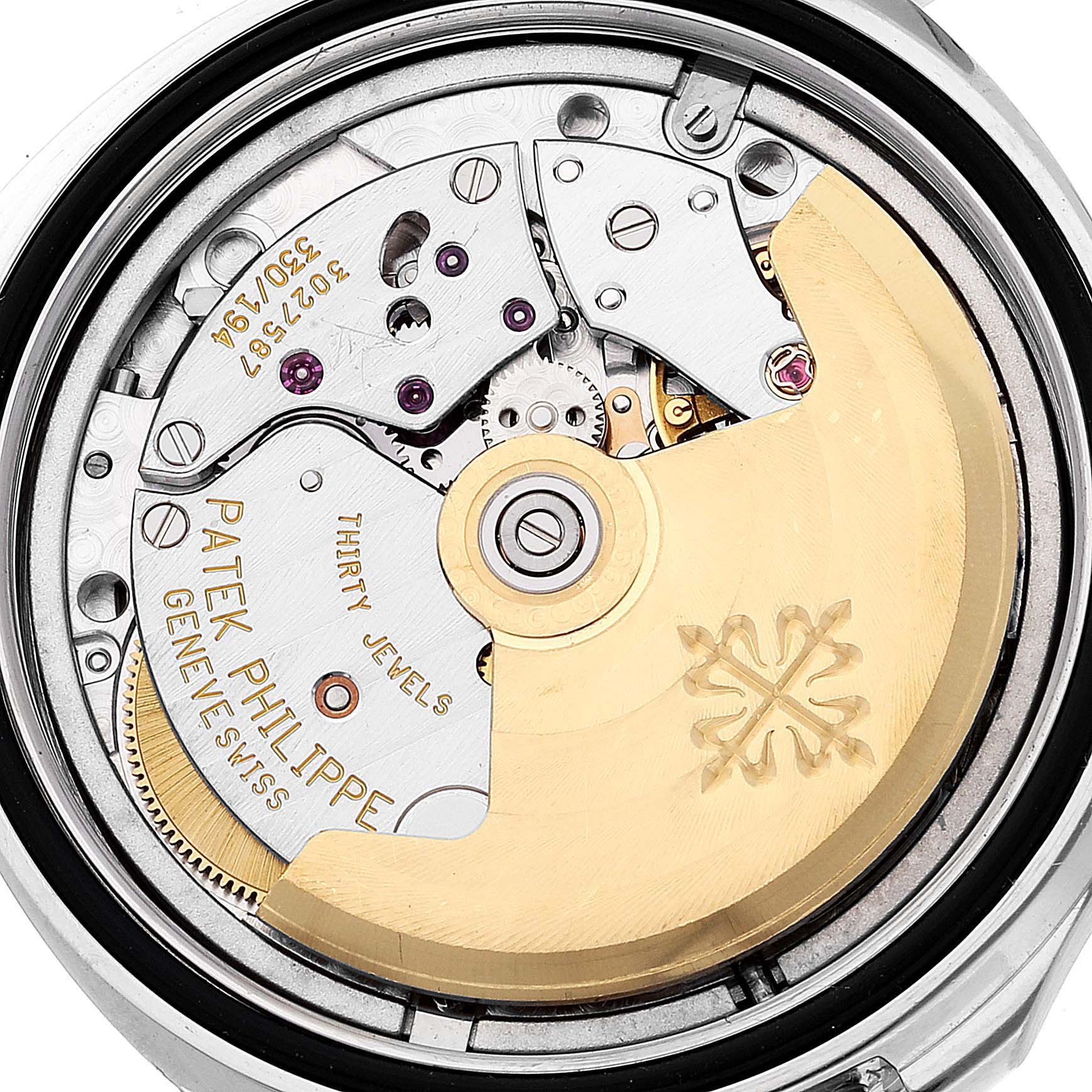 The image shows the back view of the Patek Philippe Aquanaut 5066A Men's Stainless Steel Black Dial 5066A Men's Stainless Steel Black Dial watch, highlighting its intricate movement and rotor.