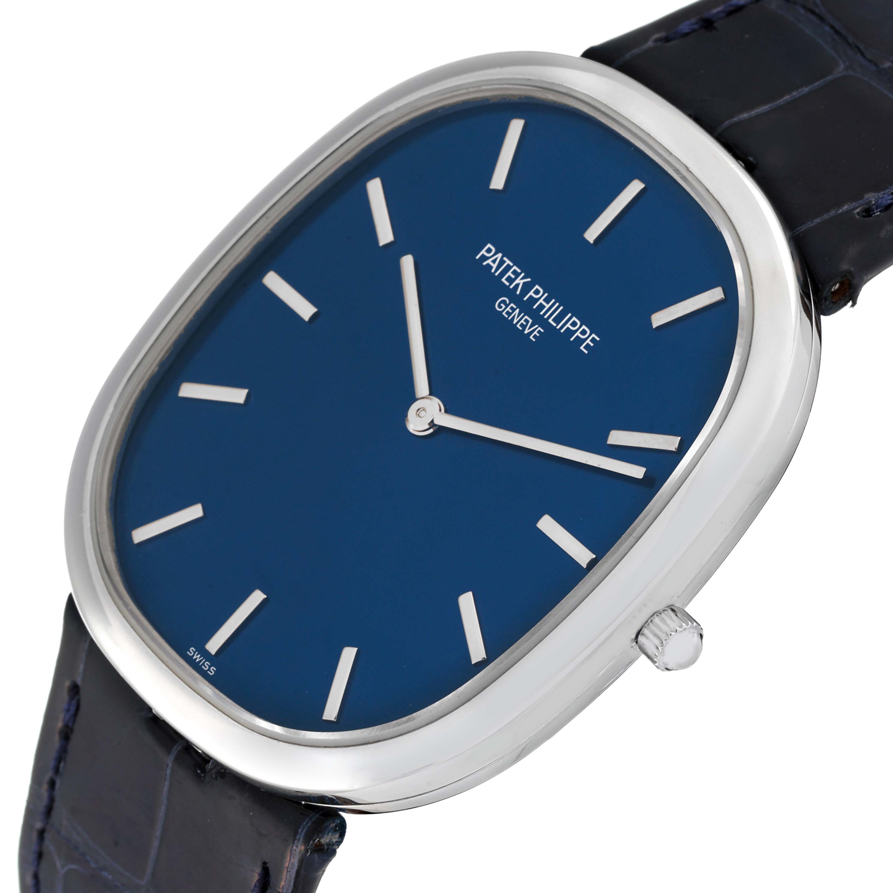 The image shows a close-up, angled view of the Patek Philippe Golden Ellipse 5738P-001 Men's Platinum Blue Dial 5738P-001 Men's Platinum Blue Dial watch, displaying its face, crown, and part of the strap.