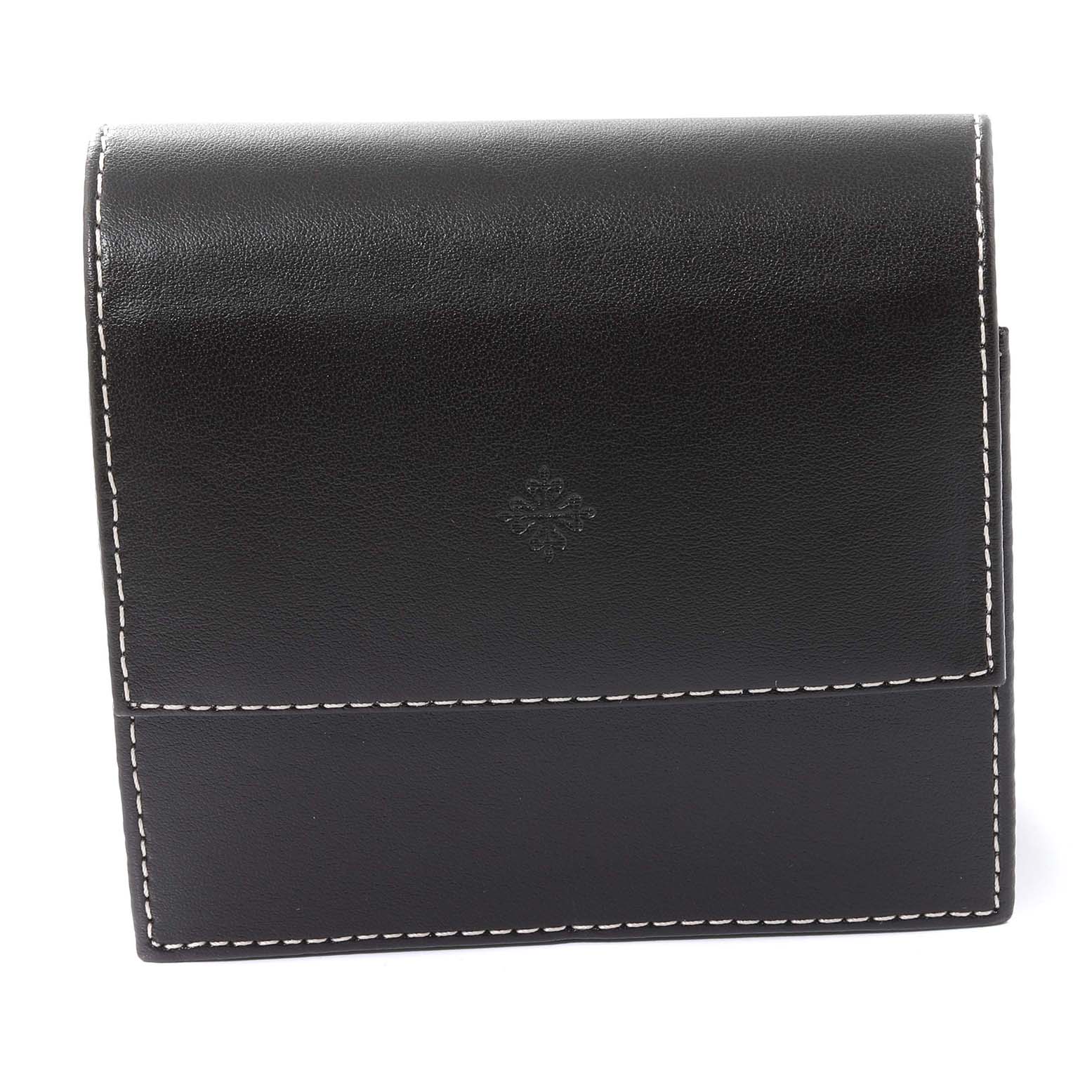 The image shows a black leather case with white stitching for the Neptune model by Patek Philippe, featuring an embossed logo.